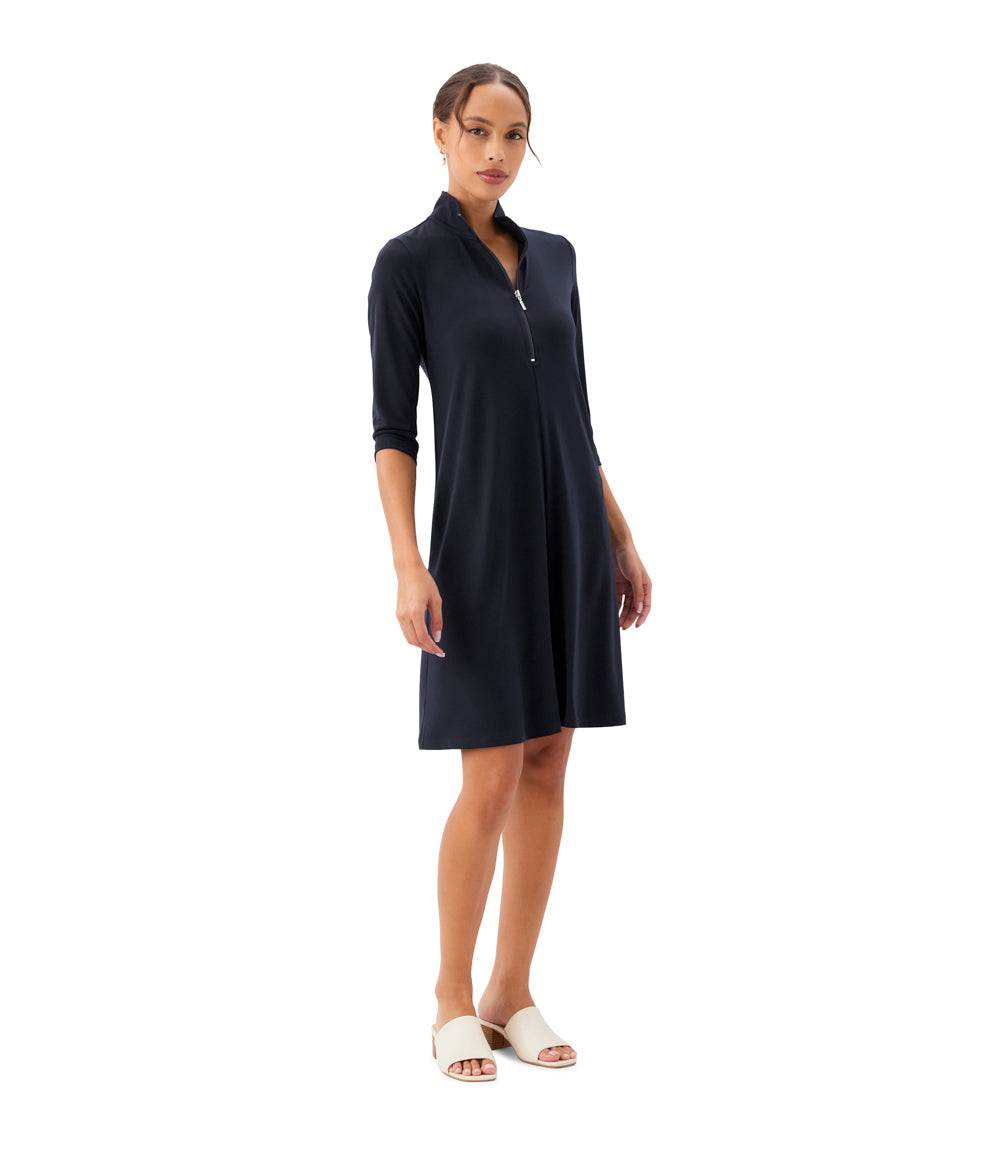 Woman wearing a black dress on a white background