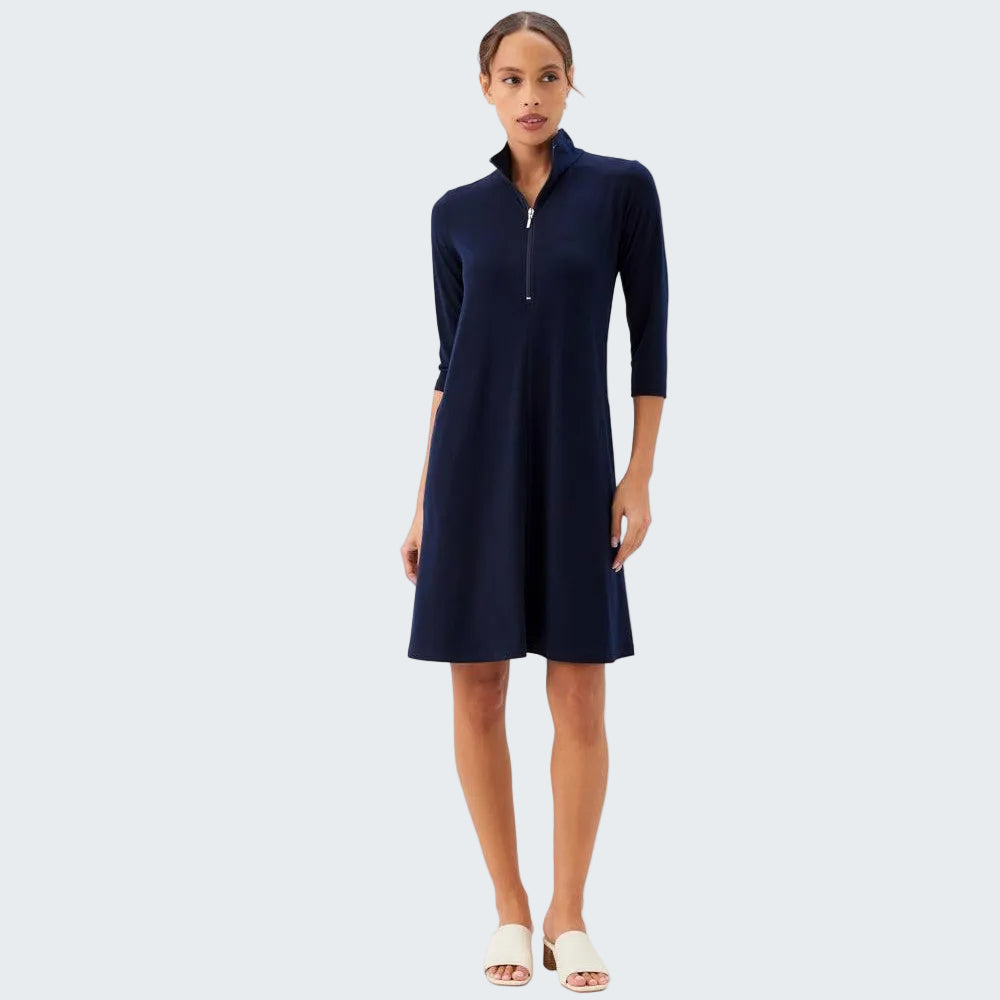 Woman wearing a navy blue dress with a zipper on a white background
