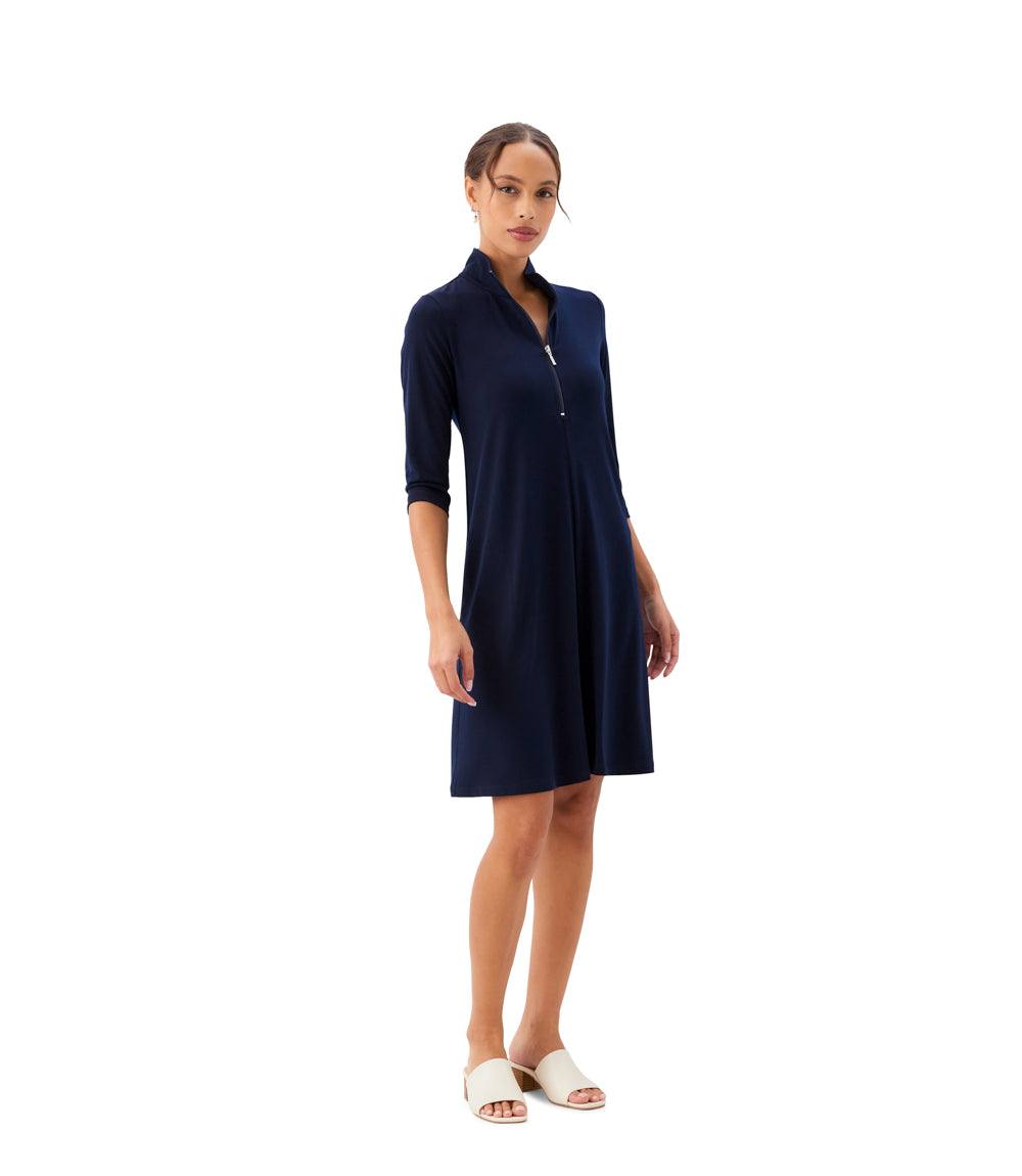 Woman wearing a navy blue dress on a white background