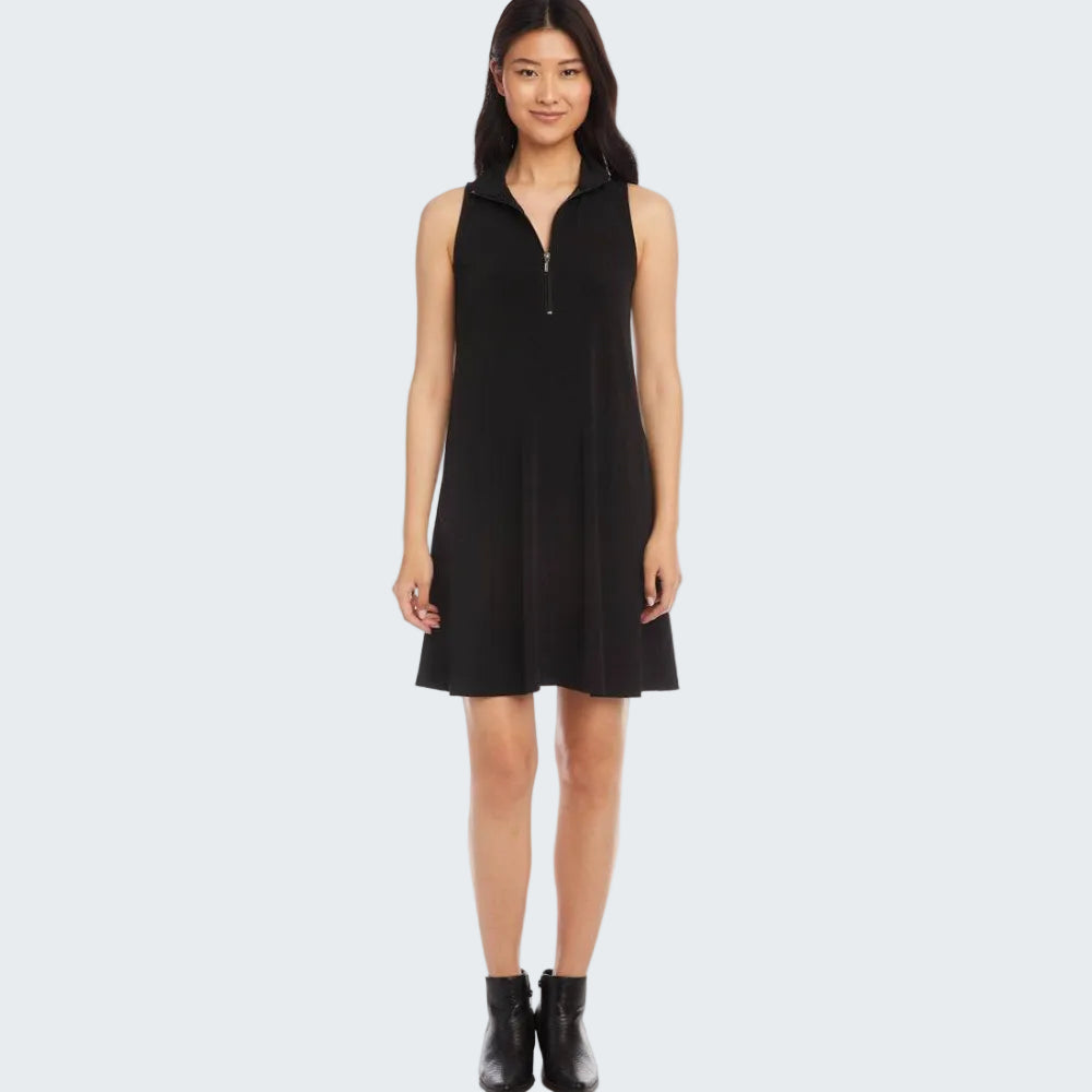 A woman modeling a sleeveless black mini dress with a half-zip collar, shown against a plain white background.