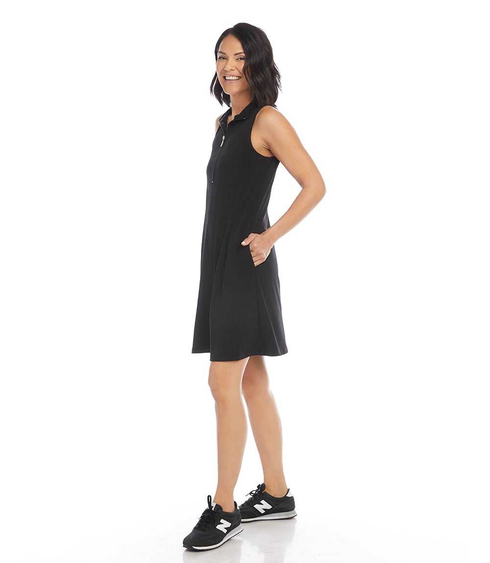 Woman wearing a black sleeveless dress on a white background