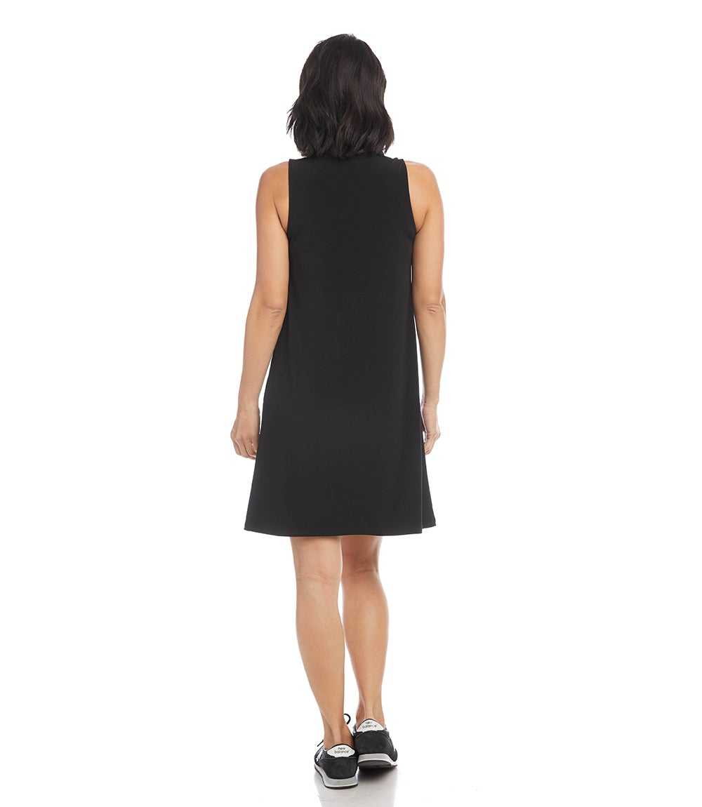 Woman wearing a black sleeveless dress on a white background