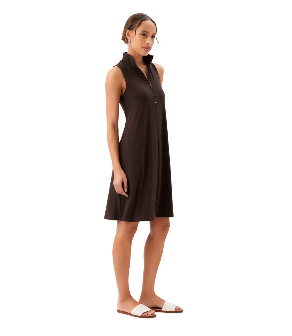 Woman wearing a brown sleeveless dress on a white background