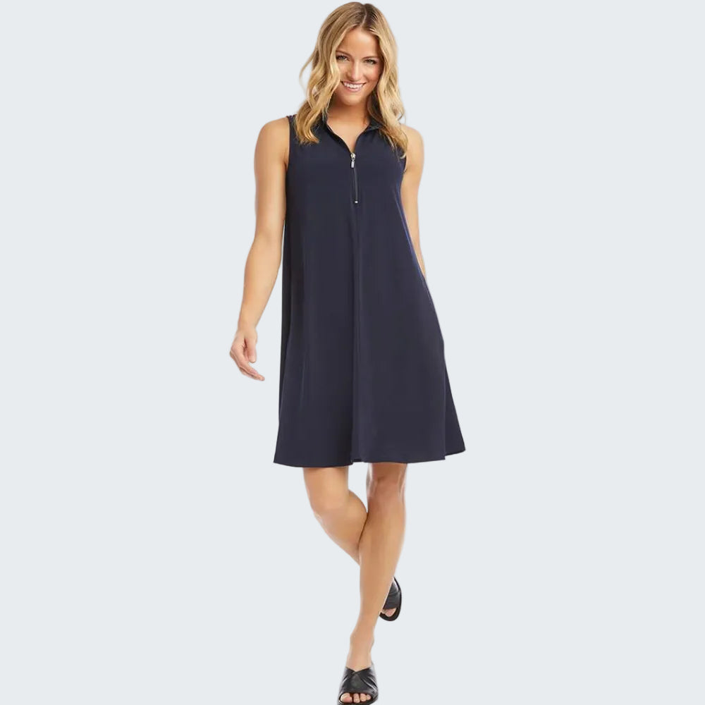 A woman modeling a sleeveless navy blue shift dress with a half-zip V-neckline, shown against a plain white background.