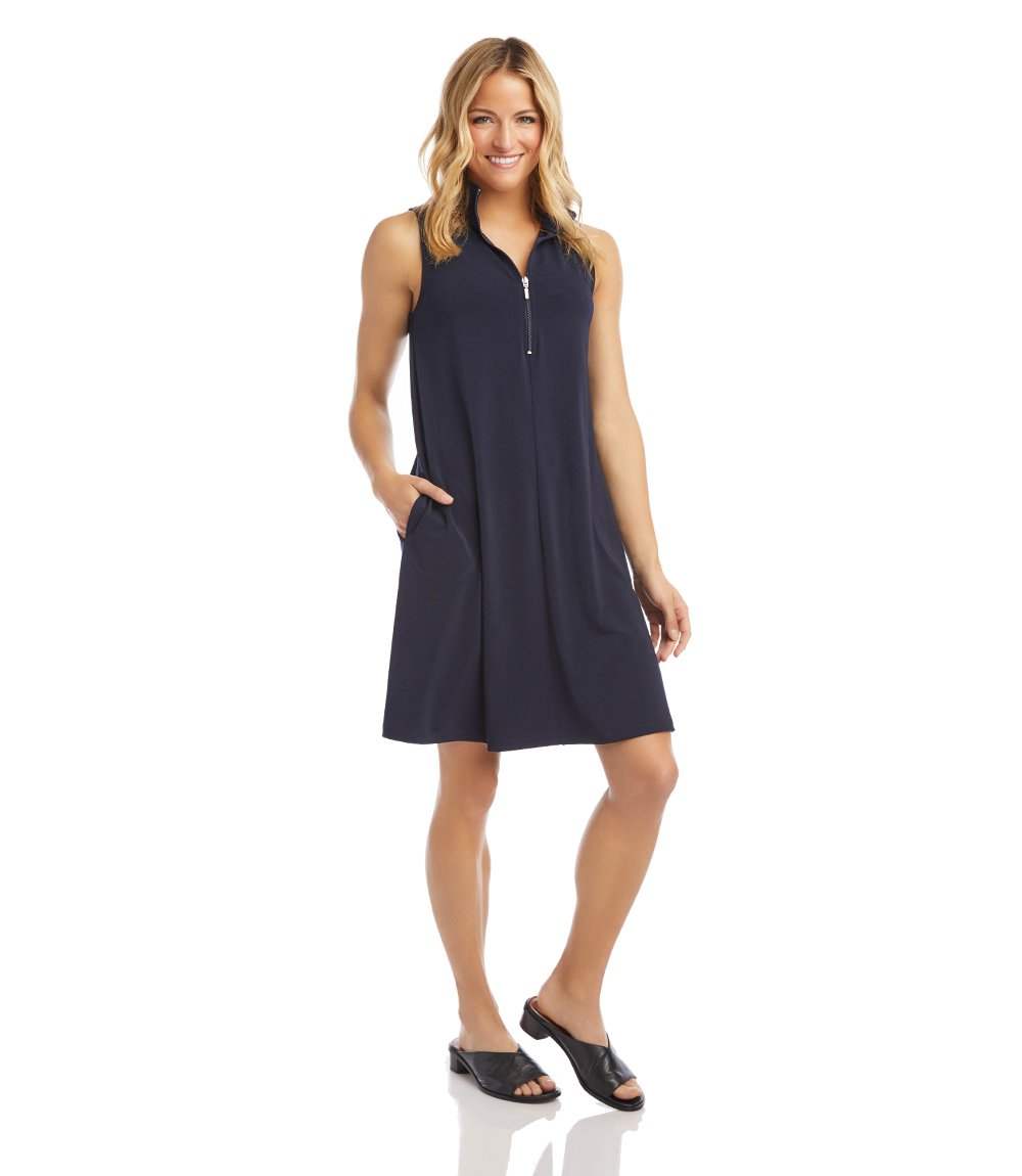 Woman wearing a navy sleeveless dress on a white background