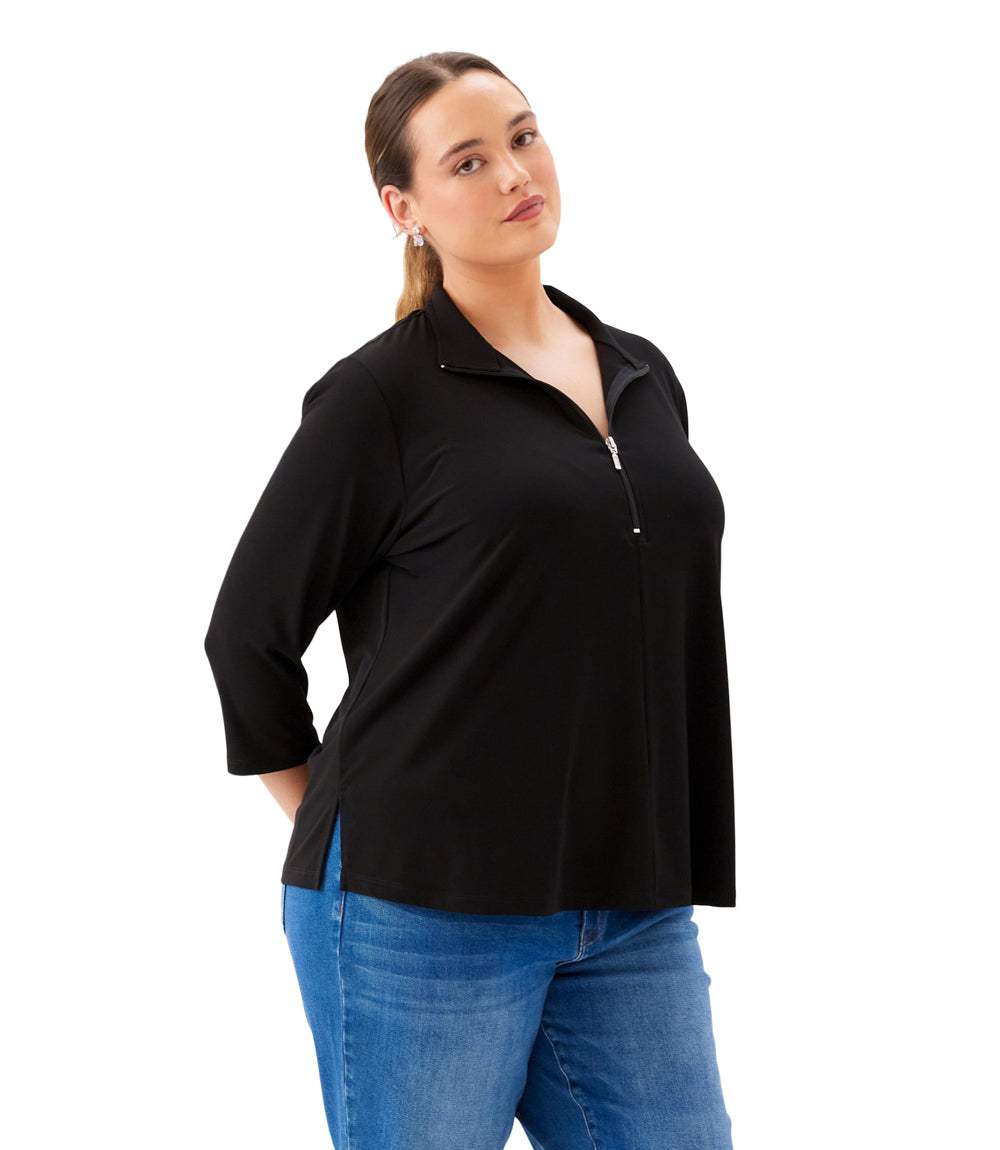 Woman wearing a black jacket and blue jeans on a white background