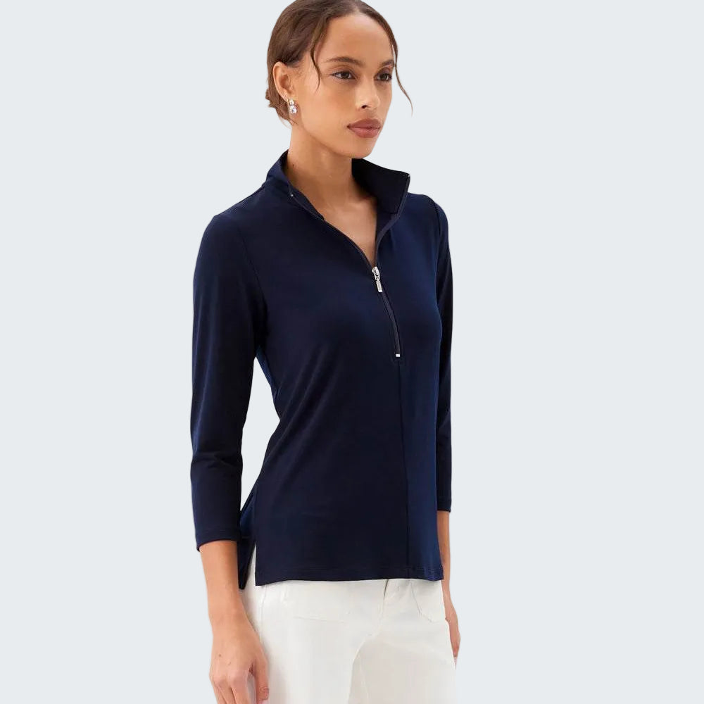 Woman wearing a navy long-sleeve top with a zipper on a white background