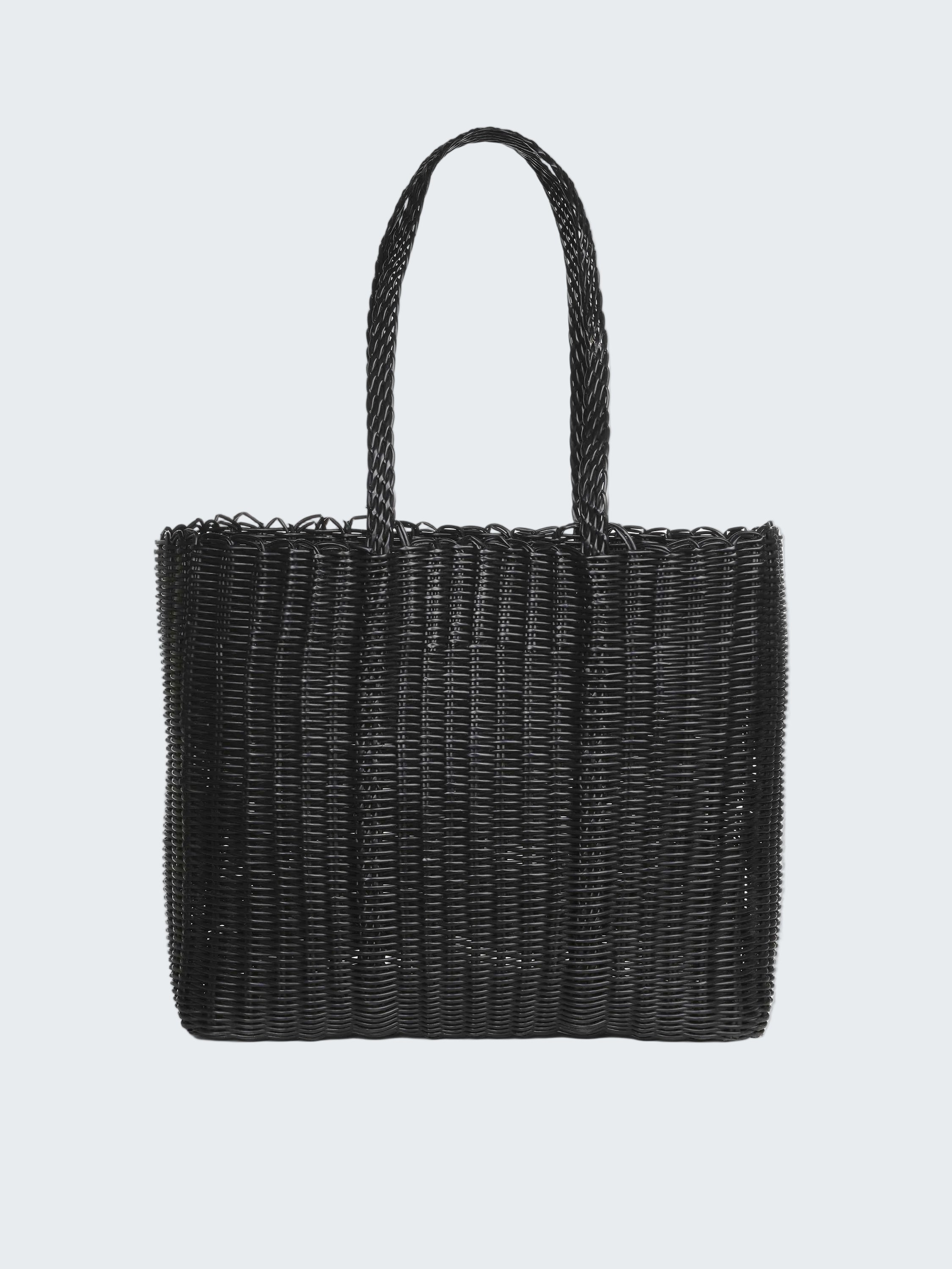 Black woven handbag on a white background