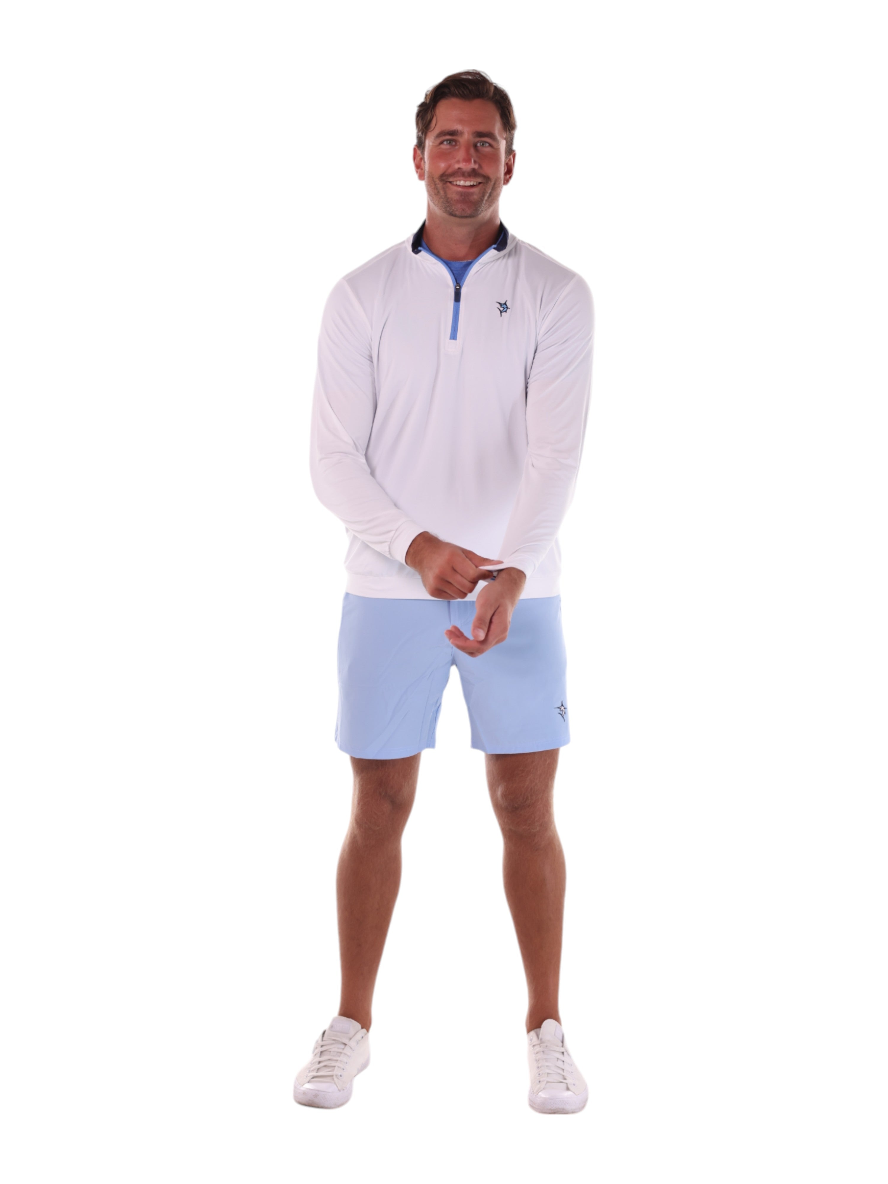 Man wearing a white sweater and light blue shorts on a white background