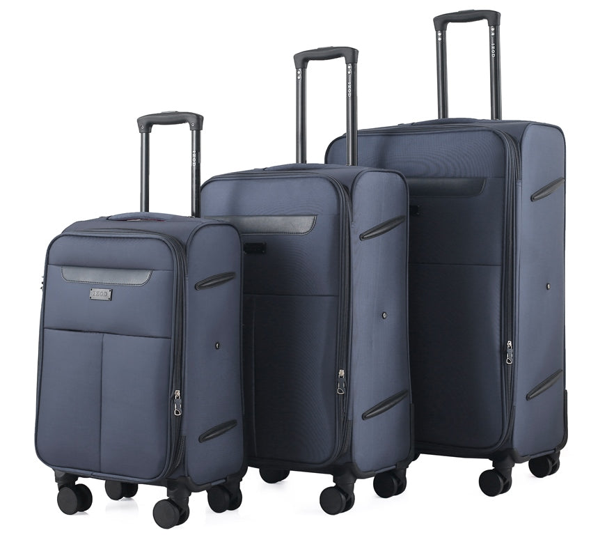 Set of three blue suitcases of different sizes on a white background
