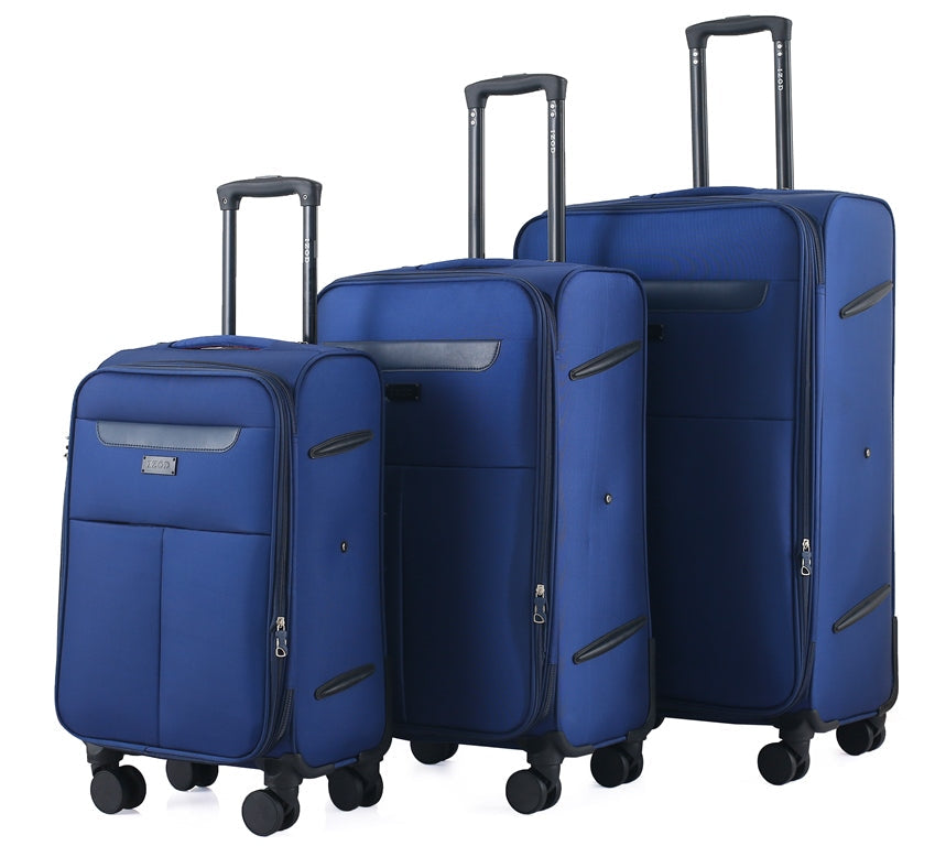Set of three blue suitcases of different sizes on a white background