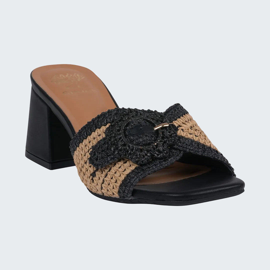 Black and brown sandal with a decorative bow on a white background