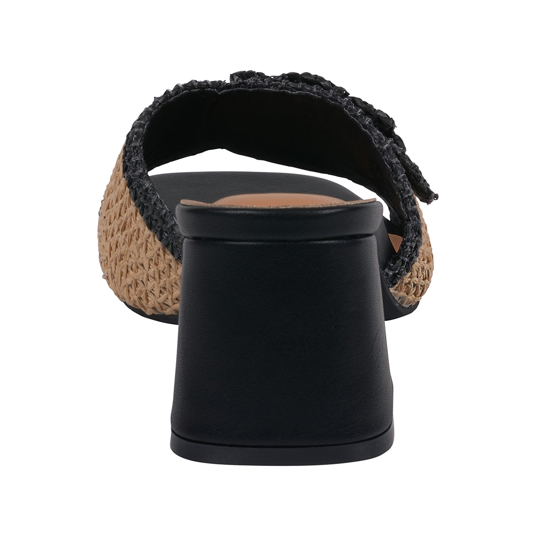 Black sandal with woven sole on a white background