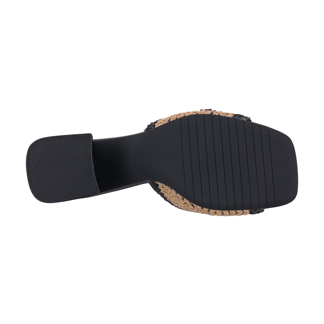 Black sandal sole with cork texture on a white background