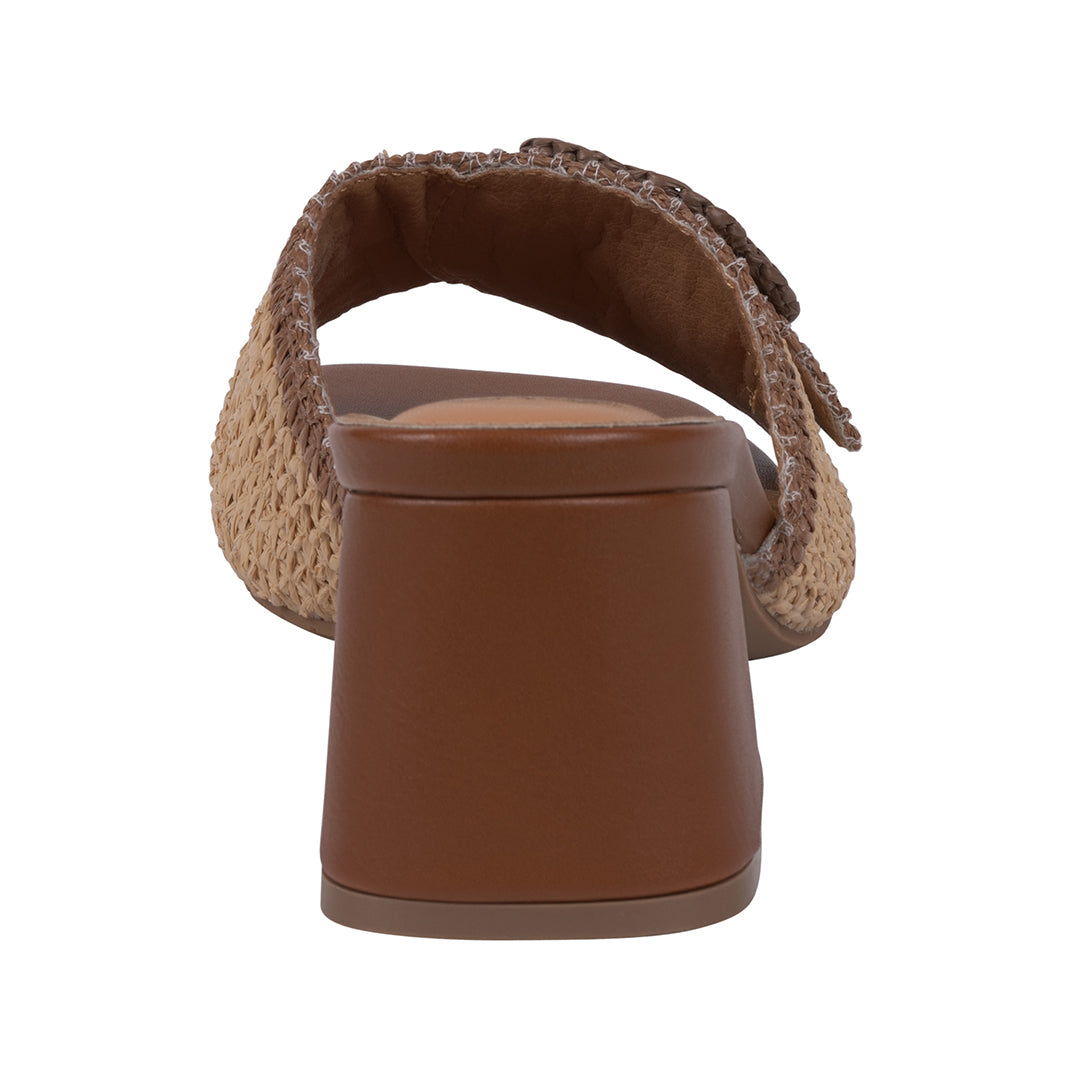 Brown sandal with woven strap on a white background