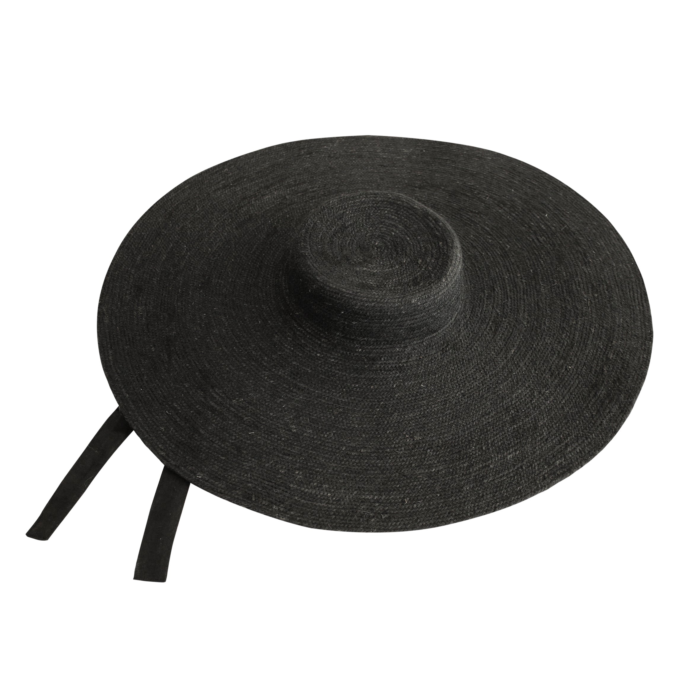Black wide-brimmed hat with a ribbon on a white background