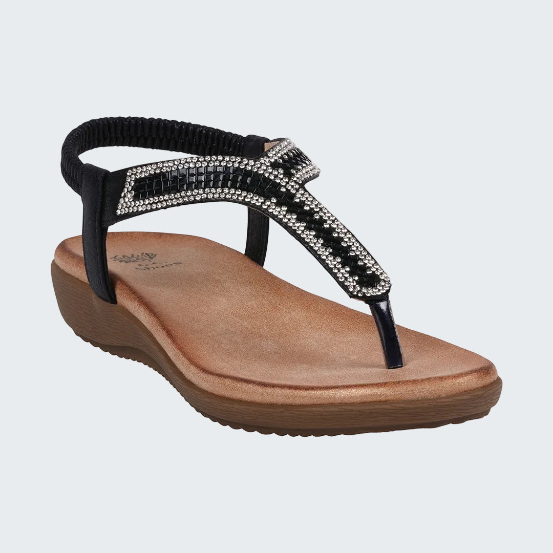Black sandal with a decorative strap on a white background