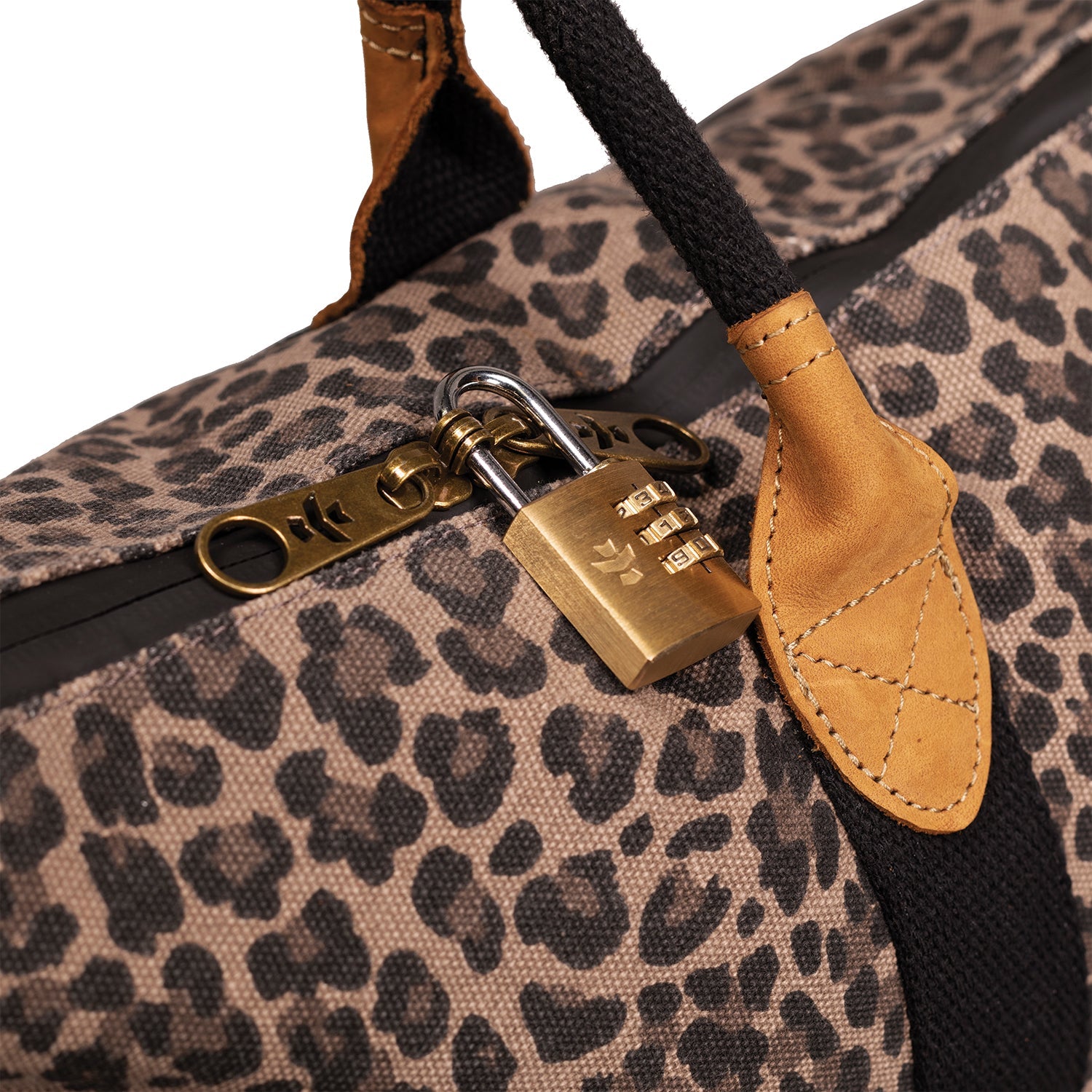 Leopard print bag with a gold combination lock on a white background
