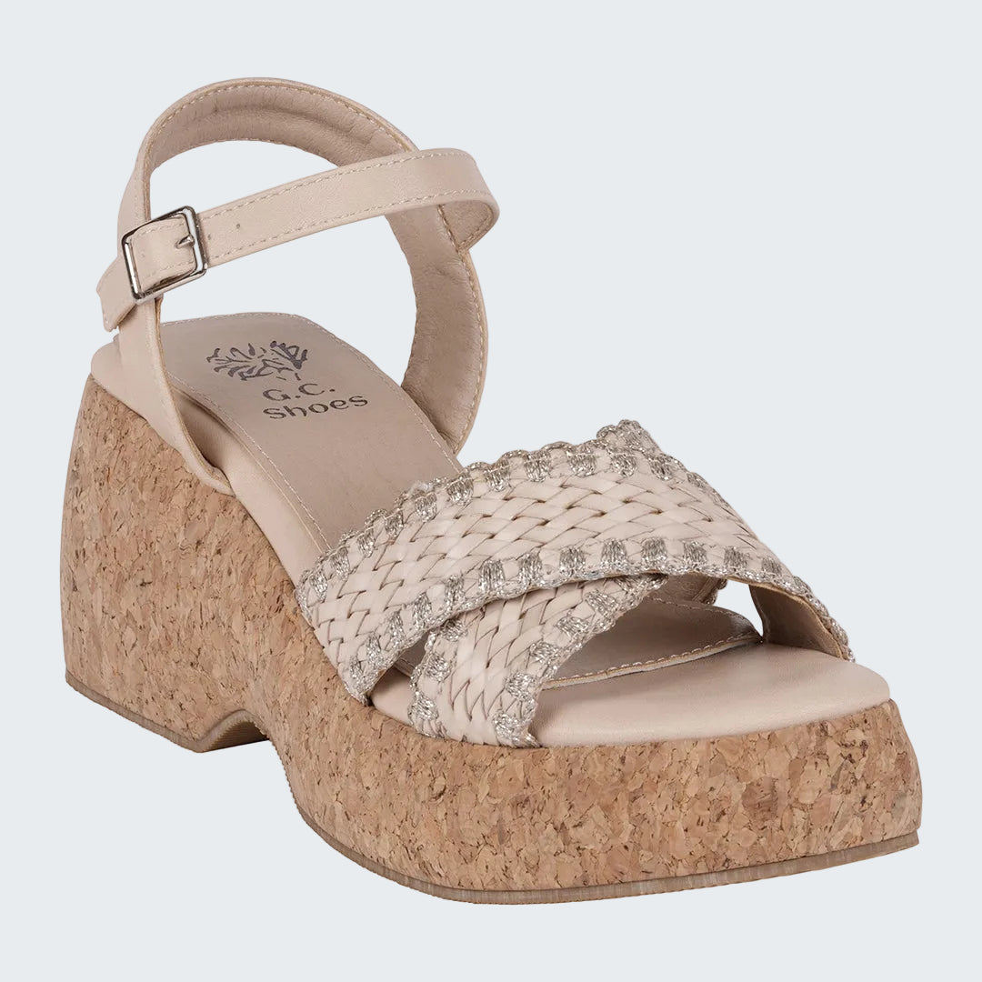 Beige wedge sandal with cork sole on a white background
