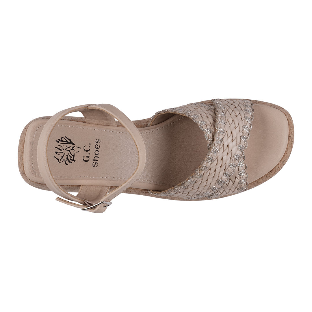 Beige sandal with woven details on a white background