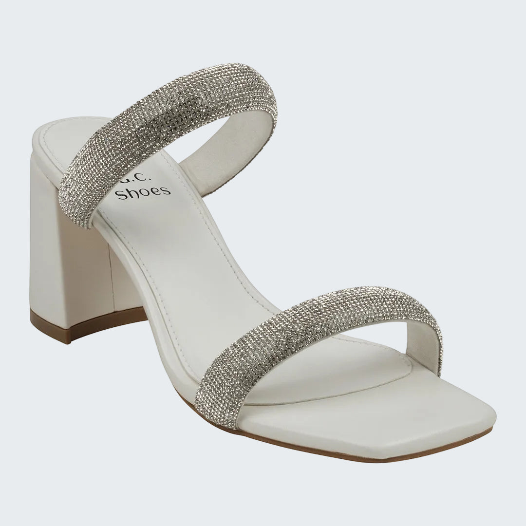 White sandal with rhinestone straps on a white background