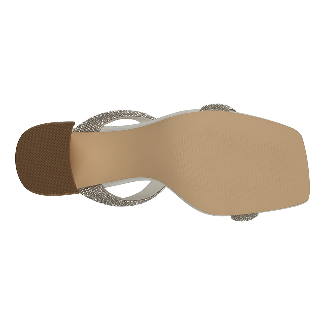 Beige sandal with brown sole on a white background