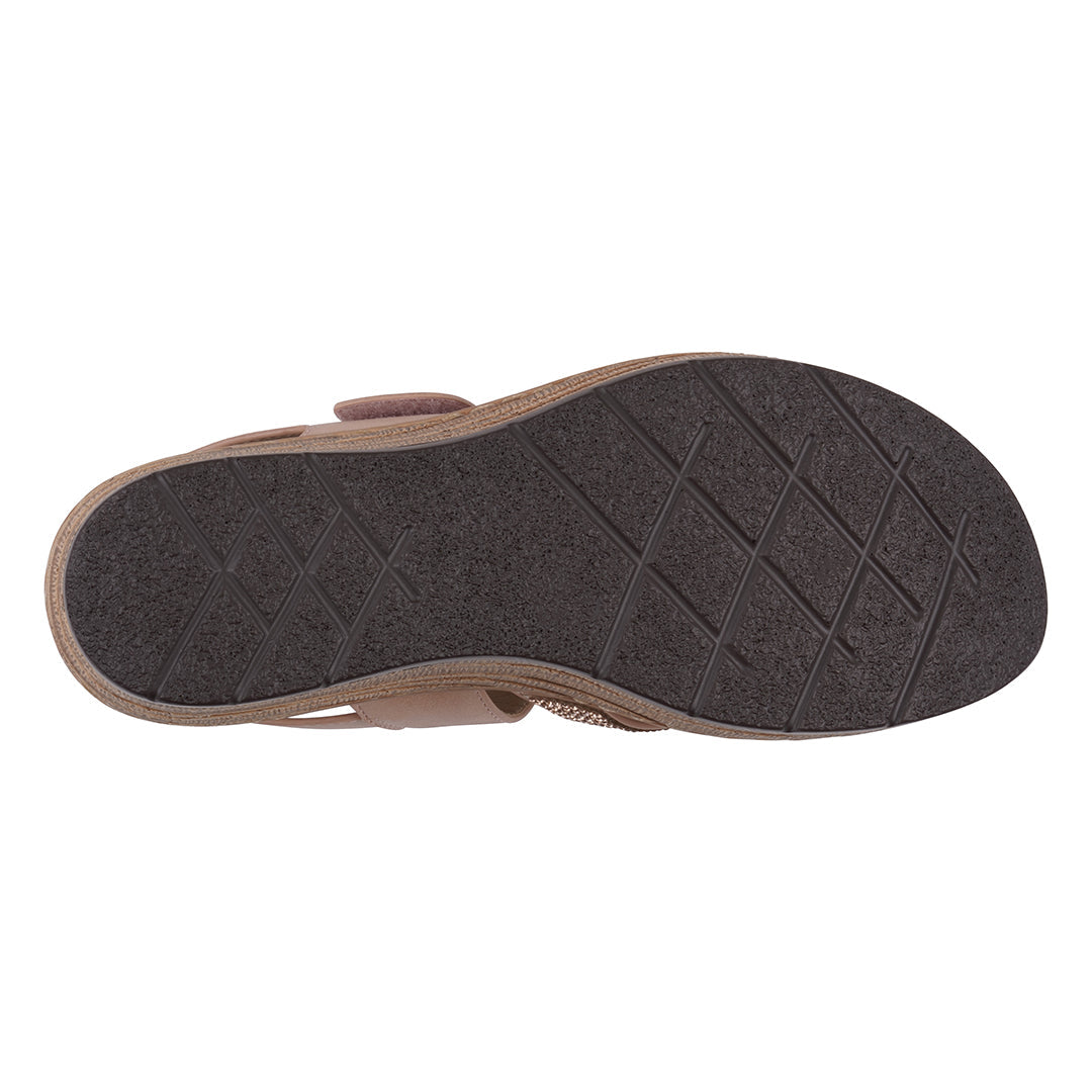 Brown sandal sole with textured pattern on a white background