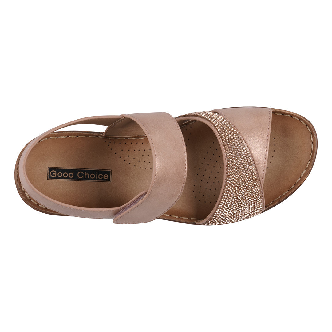 Pair of beige sandals with 'Good Choice' label on a white background