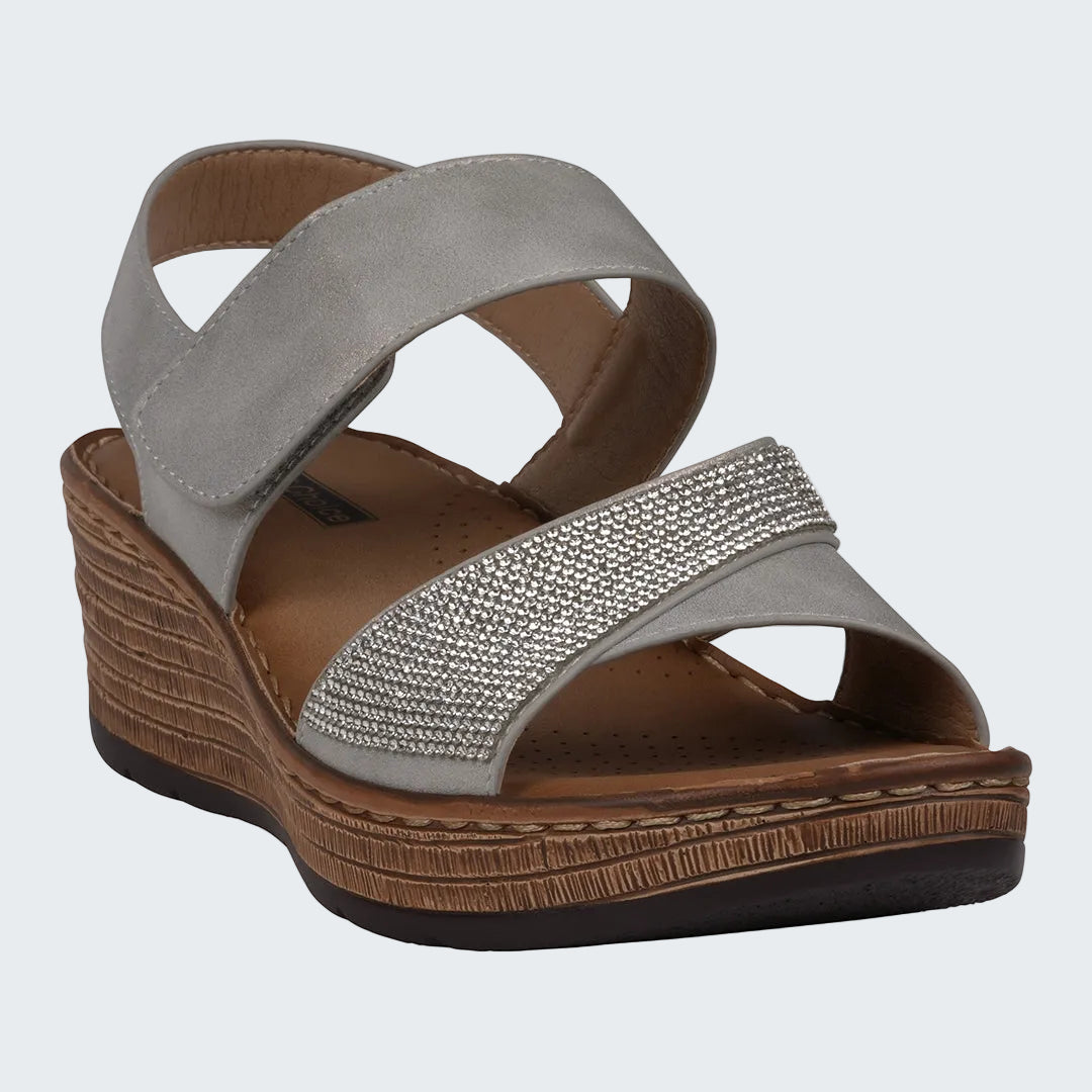 Gray sandal with a brown wedge sole on a white background