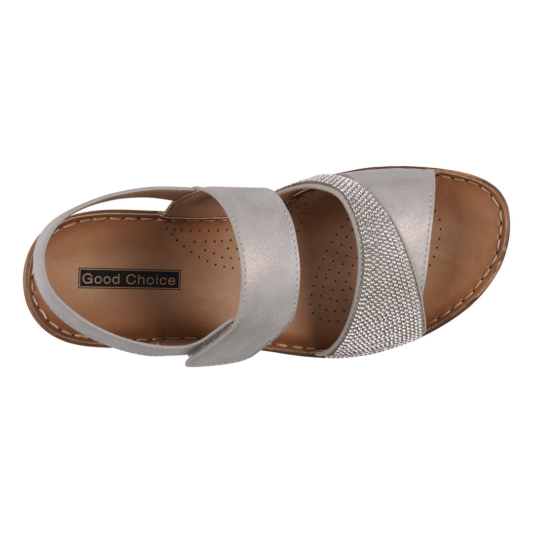 Silver sandal with brown accents on a white background
