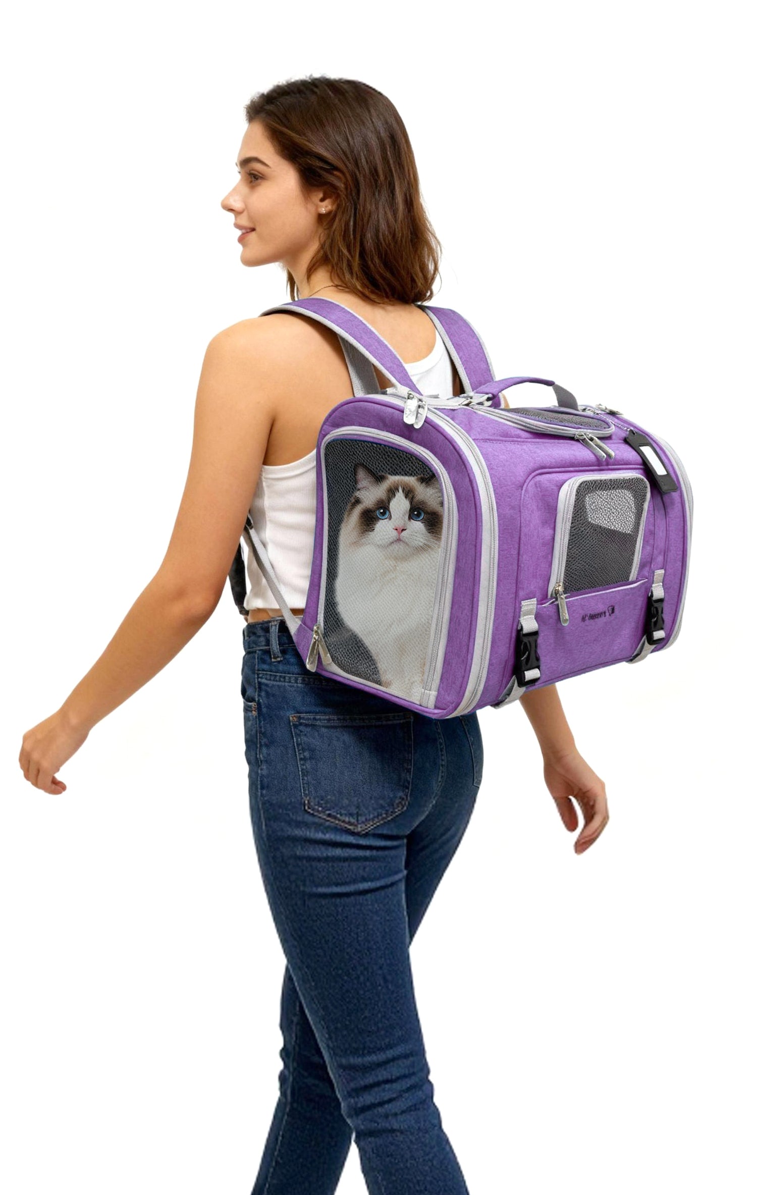 Woman carrying a purple pet carrier with a cat inside on a white background