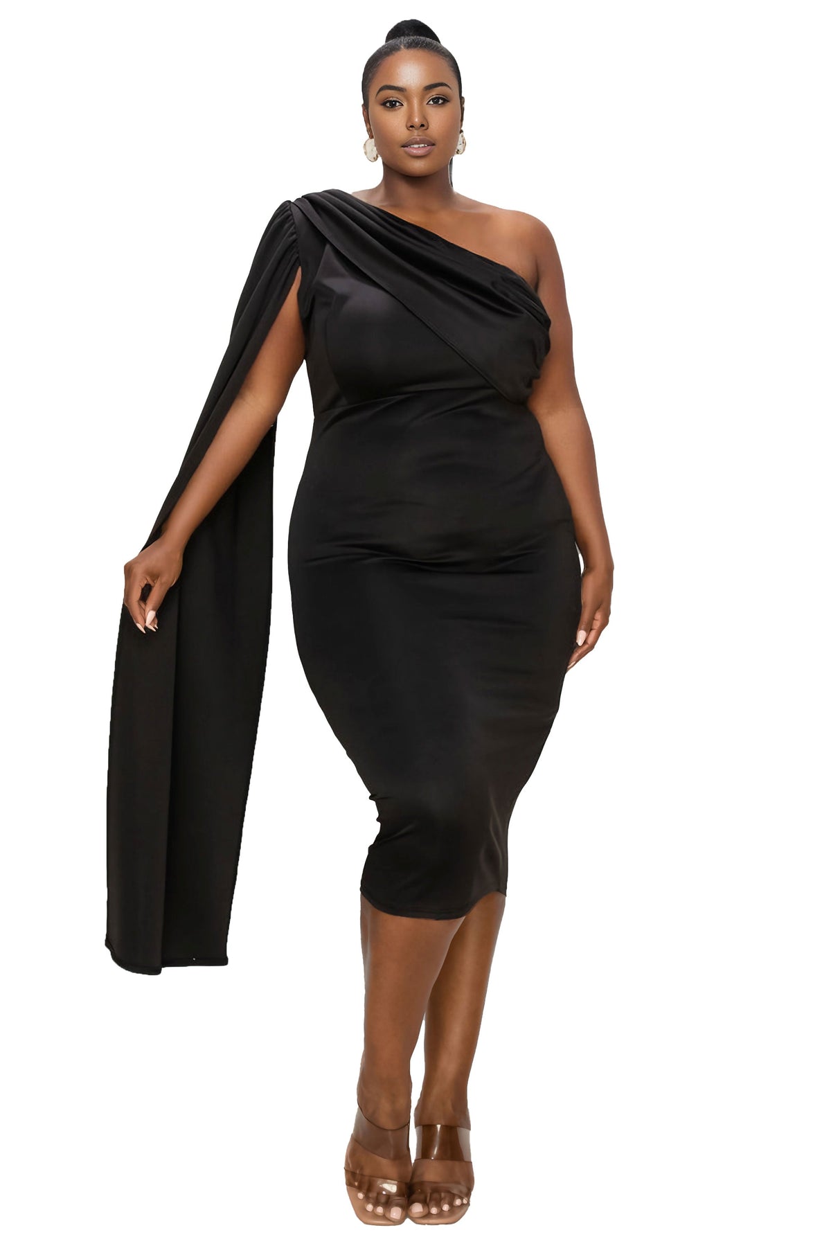 A woman modeling a black one-shoulder midi dress with a draped cape detail, paired with brown high-heeled sandals, against a solid white background.