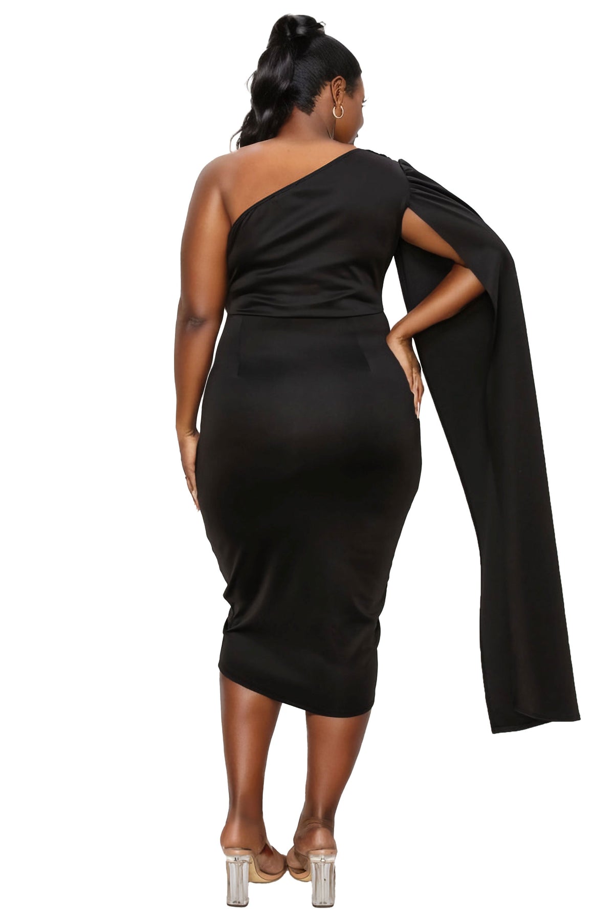 A woman modeling a black one-shoulder midi dress with a dramatic draped cape detail on the arm, shown from the back against a plain white background.