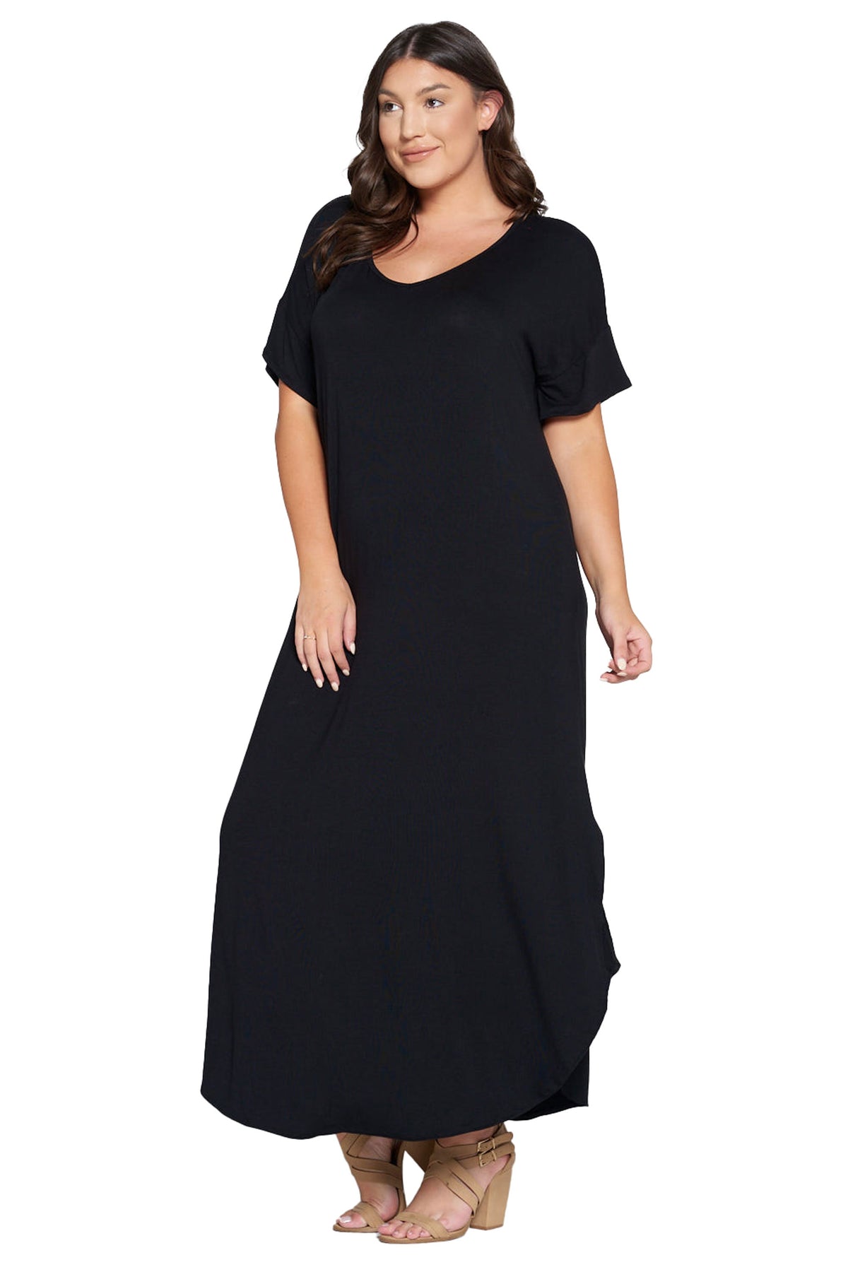A woman modeling a black short-sleeve maxi dress with a scoop neckline, photographed against a plain white studio background.