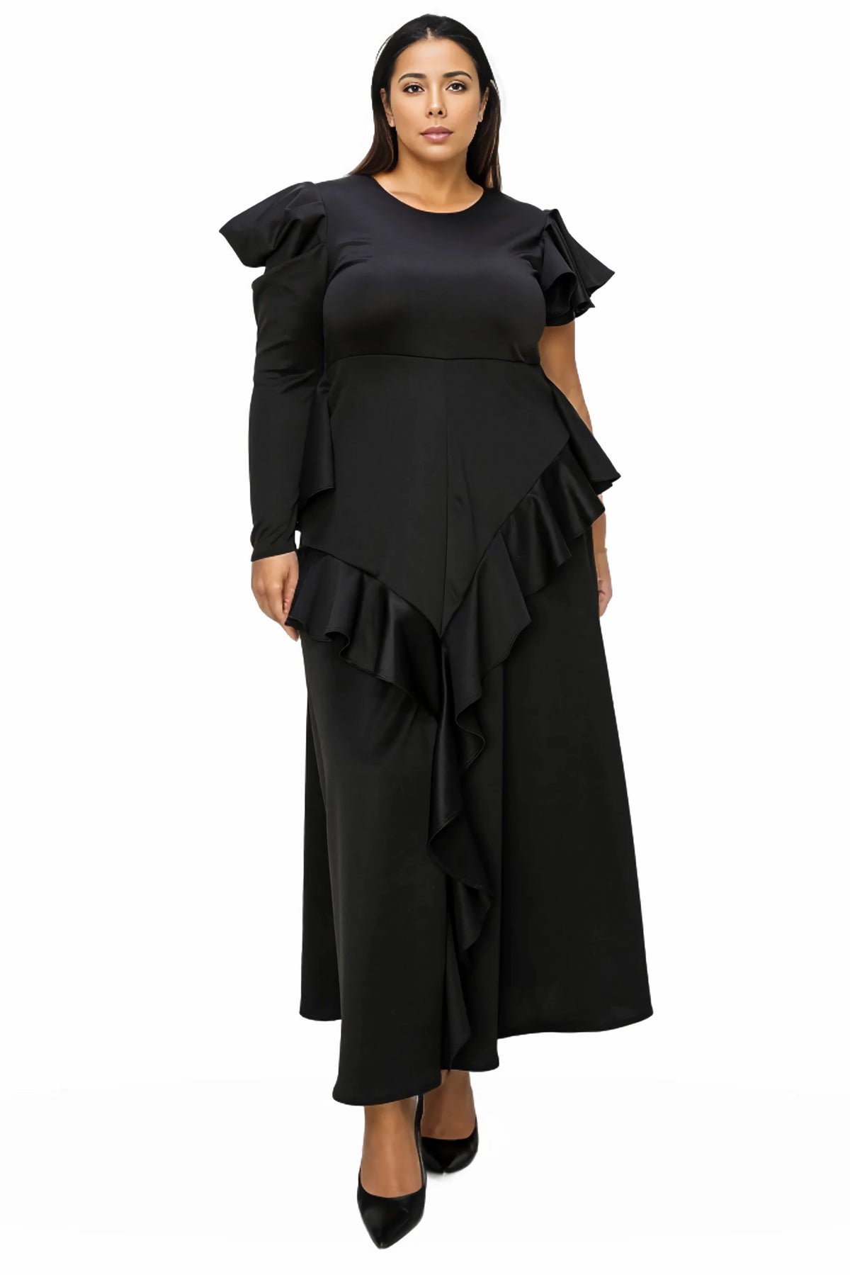 A woman modeling a black long maxi dress with ruffled shoulder details, long sleeves, and an asymmetrical ruffled hem, shown against a plain white background.