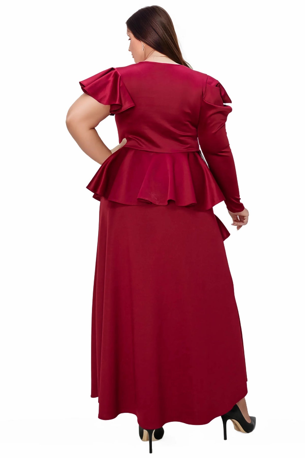 A woman modeling a long-sleeve maxi dress from the back, featuring ruffled shoulder details, a peplum waist, and a flowing skirt in a deep burgundy red, set against a plain white background.