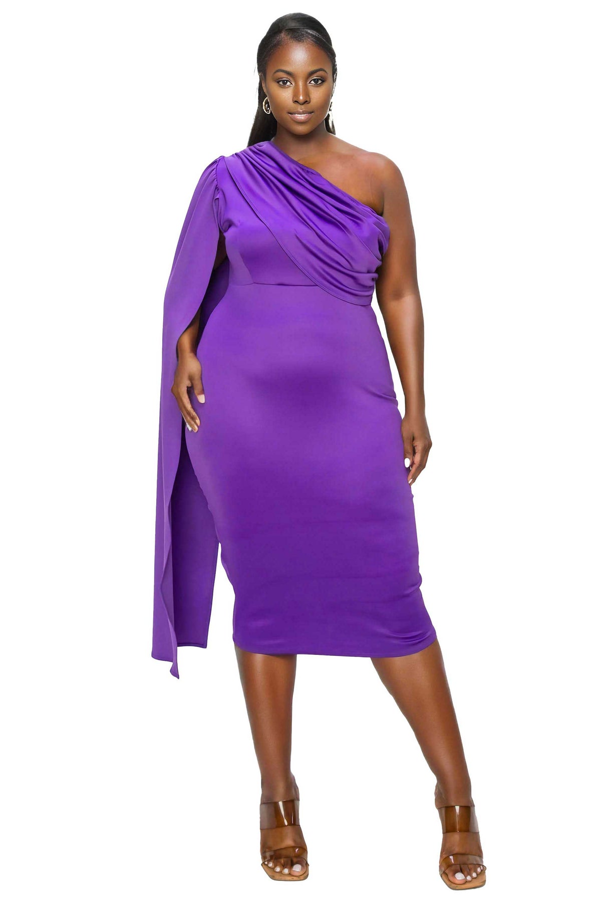 A woman modeling a vibrant purple one-shoulder midi dress with a draped neckline and a long flowing sleeve, paired with brown heeled sandals against a plain white background.