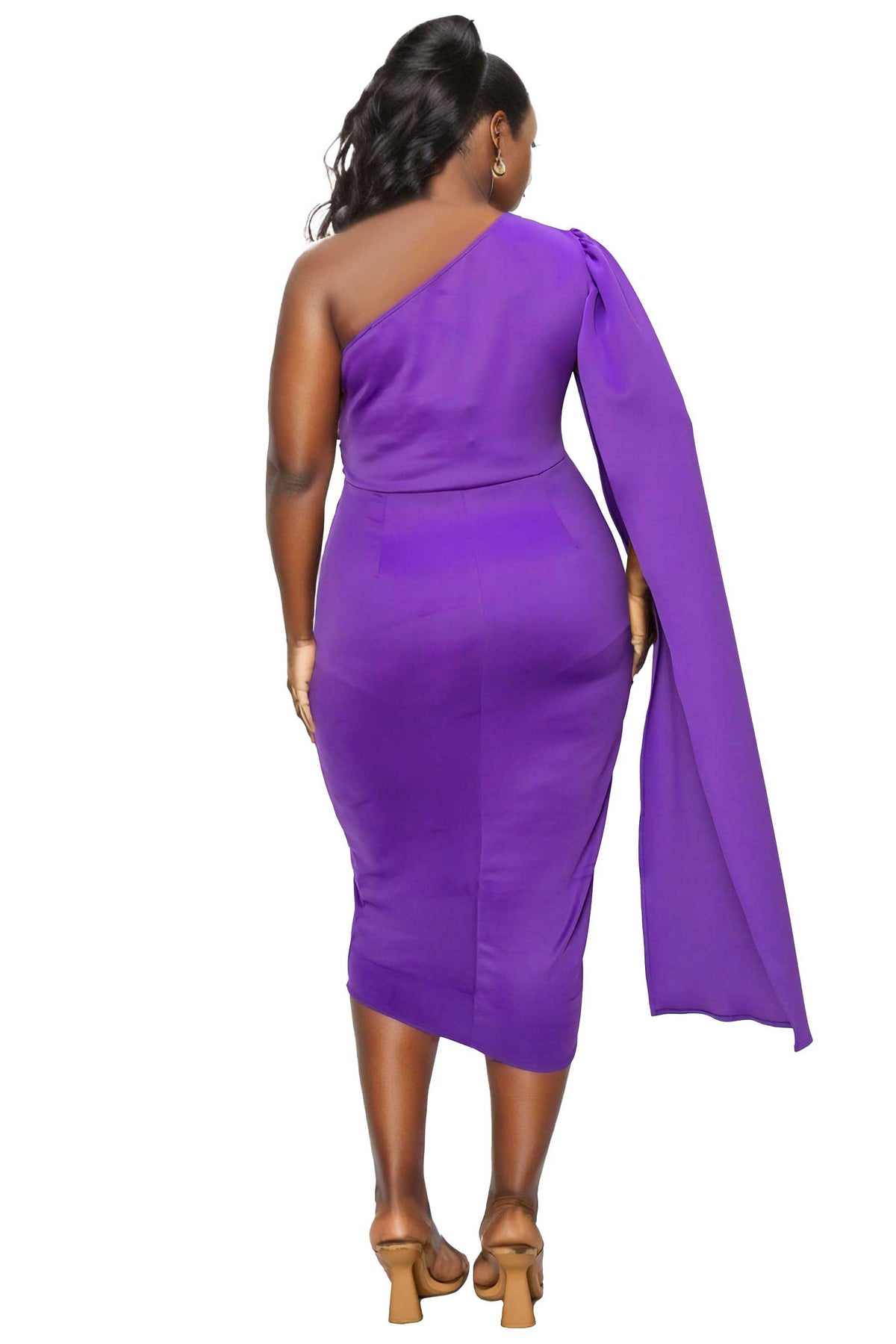 A woman shown from the back wearing a bright purple one-shoulder midi dress with a long draped cape-style sleeve and tan heeled sandals, against a plain white background.