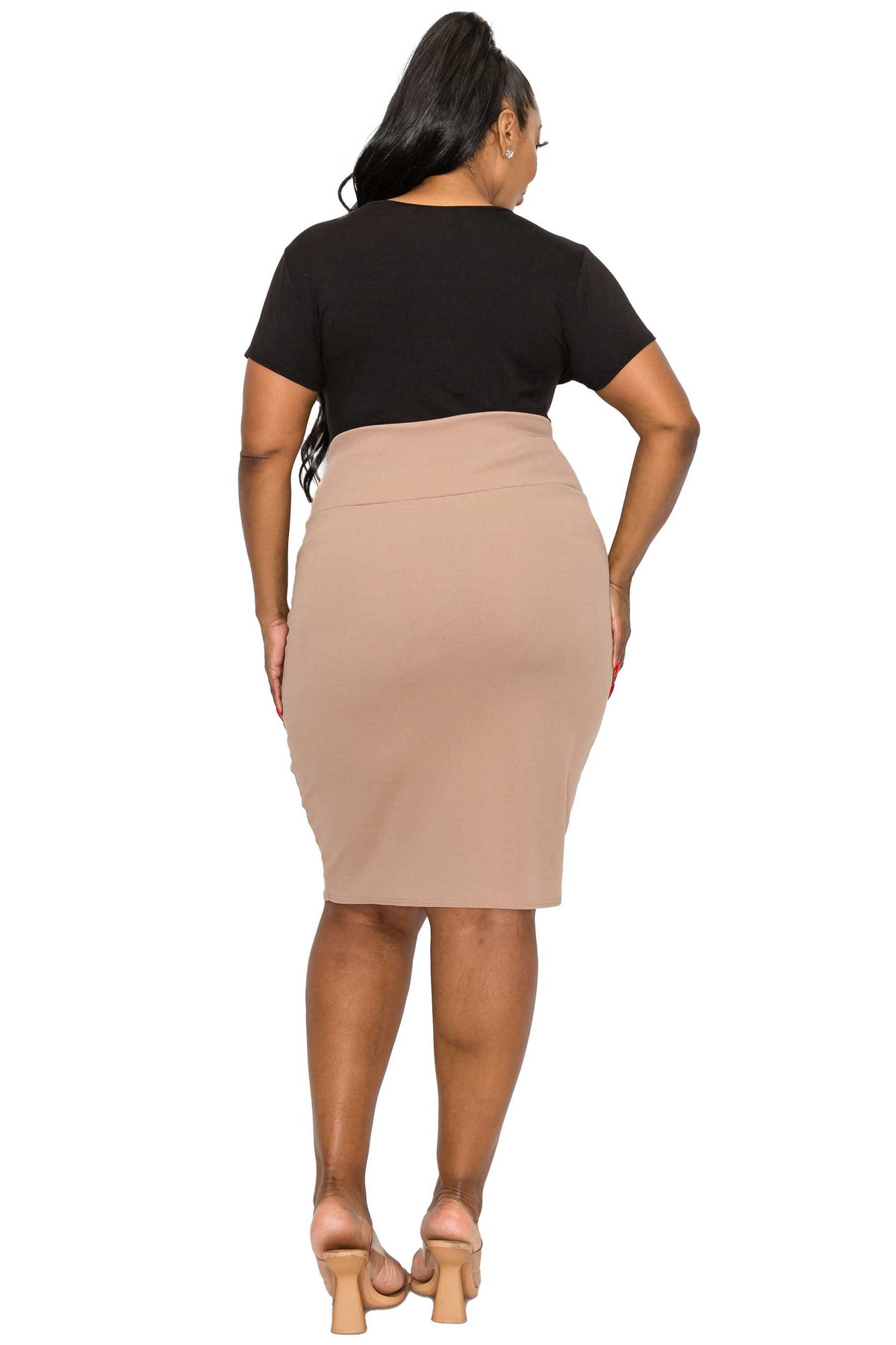 A woman shown from the back wearing a black short-sleeve top and a beige high-waisted pencil skirt, paired with beige high-heeled sandals, against a plain white background.