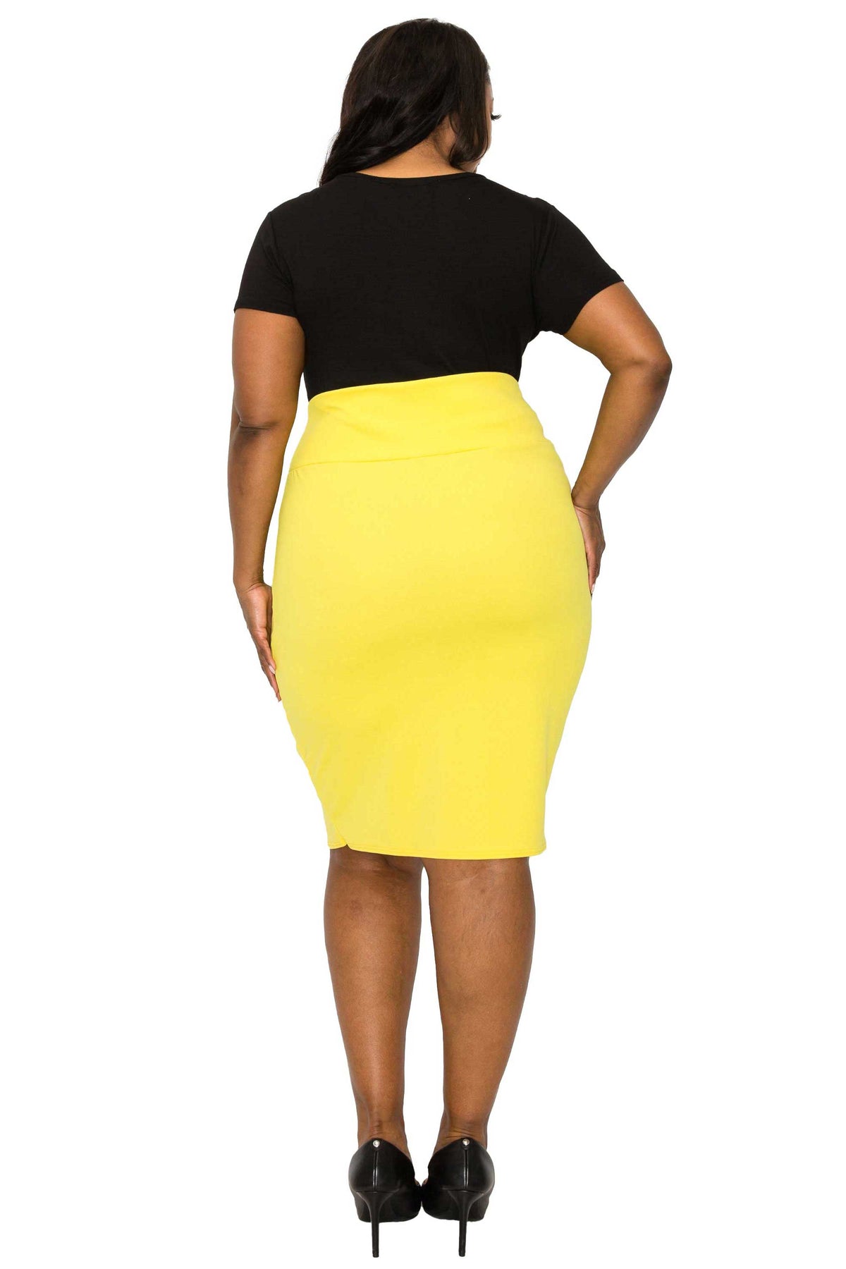 A woman shown from the back wearing a bright yellow knee-length pencil skirt with a black short-sleeve top and black heels, against a plain white background.