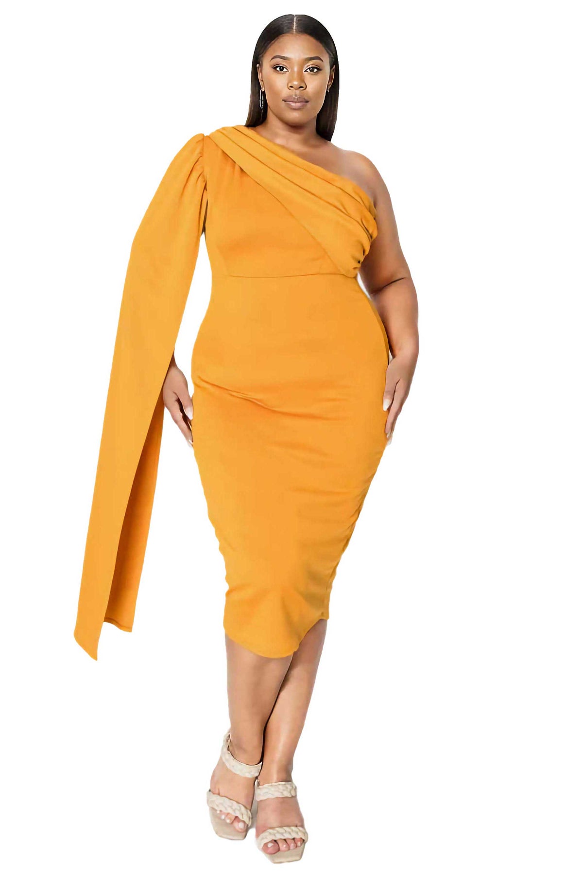 A woman modeling a bright yellow-orange one-shoulder midi dress with a draped cape-style sleeve, paired with beige strappy high-heeled sandals, against a plain white background.