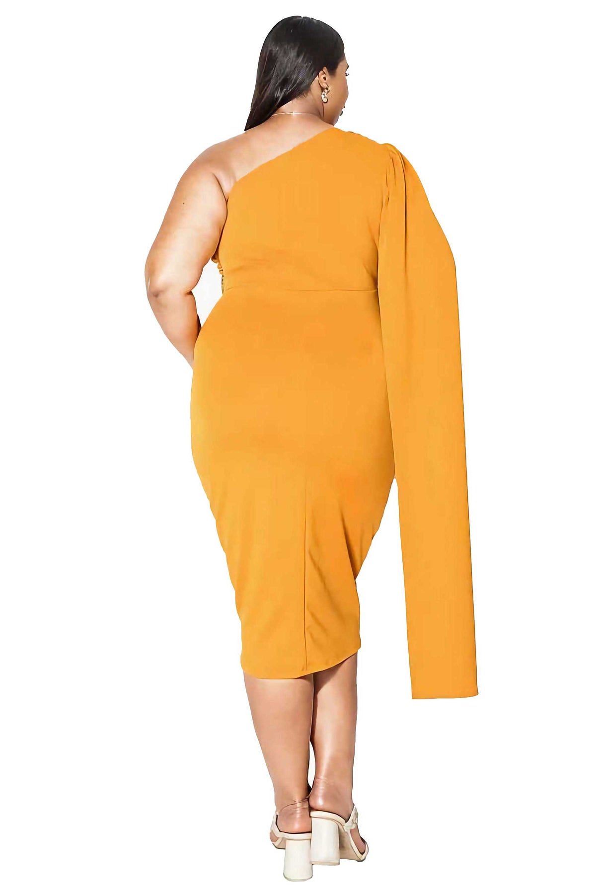 A woman shown from the back wearing a mustard yellow one-shoulder midi dress with a long draped sleeve, paired with white block-heel sandals, against a plain white background.