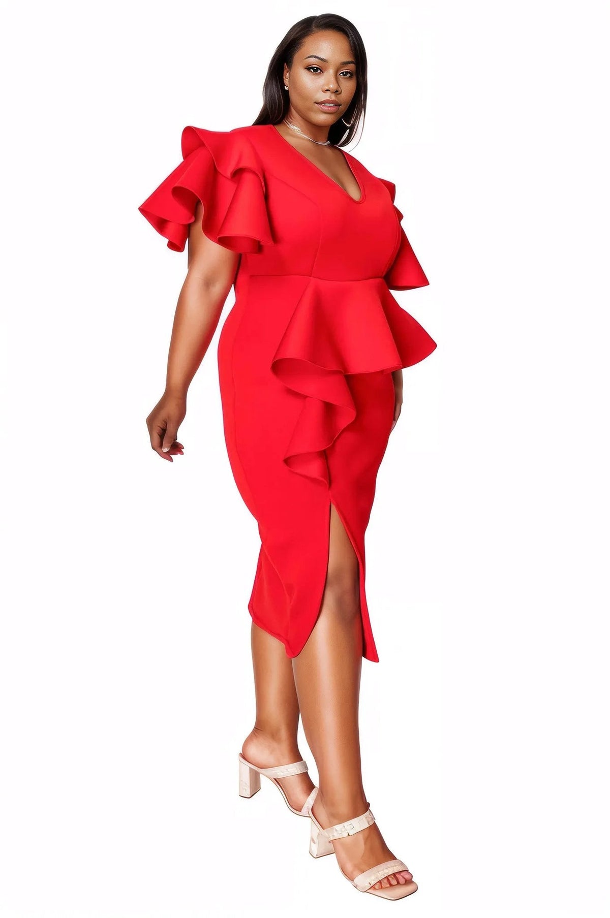 A woman modeling a bright red ruffled midi dress with a V-neckline and side slit, paired with white heeled sandals, against a plain white background.