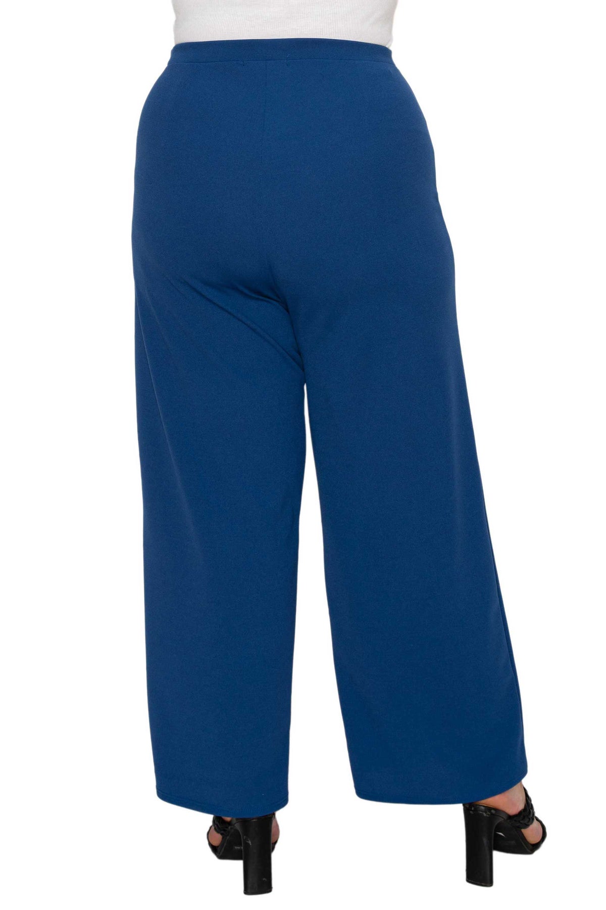 Blue wide-leg cropped pants shown from the back on a model, paired with a white top and black high-heeled sandals against a white background.