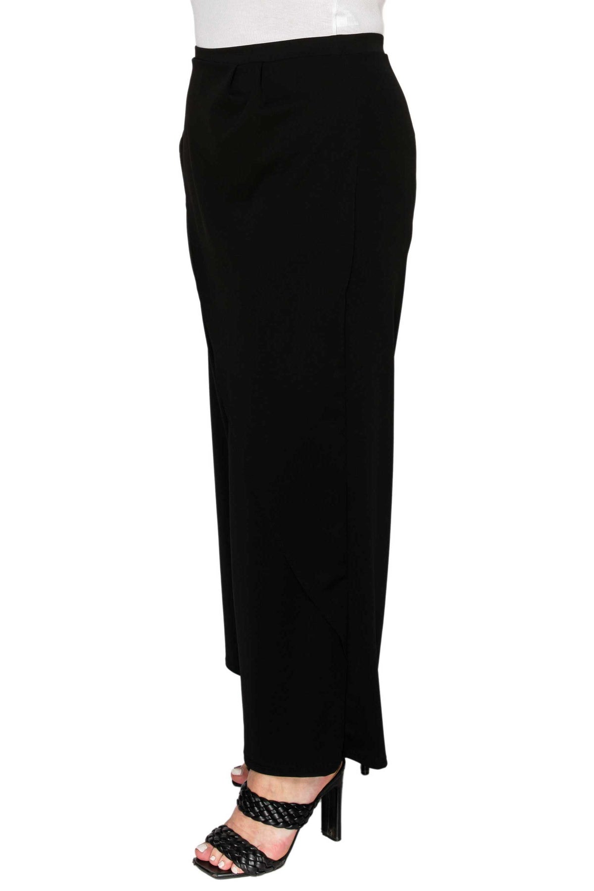 A black high-waisted ankle-length skirt with a draped, asymmetrical hem, shown on a model wearing black strappy heels against a white background.