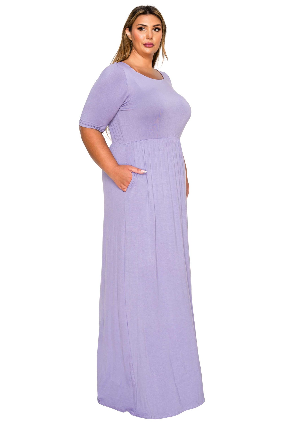 A woman modeling a lavender purple short-sleeve maxi dress with a pleated texture and side pockets, set against a plain white background.