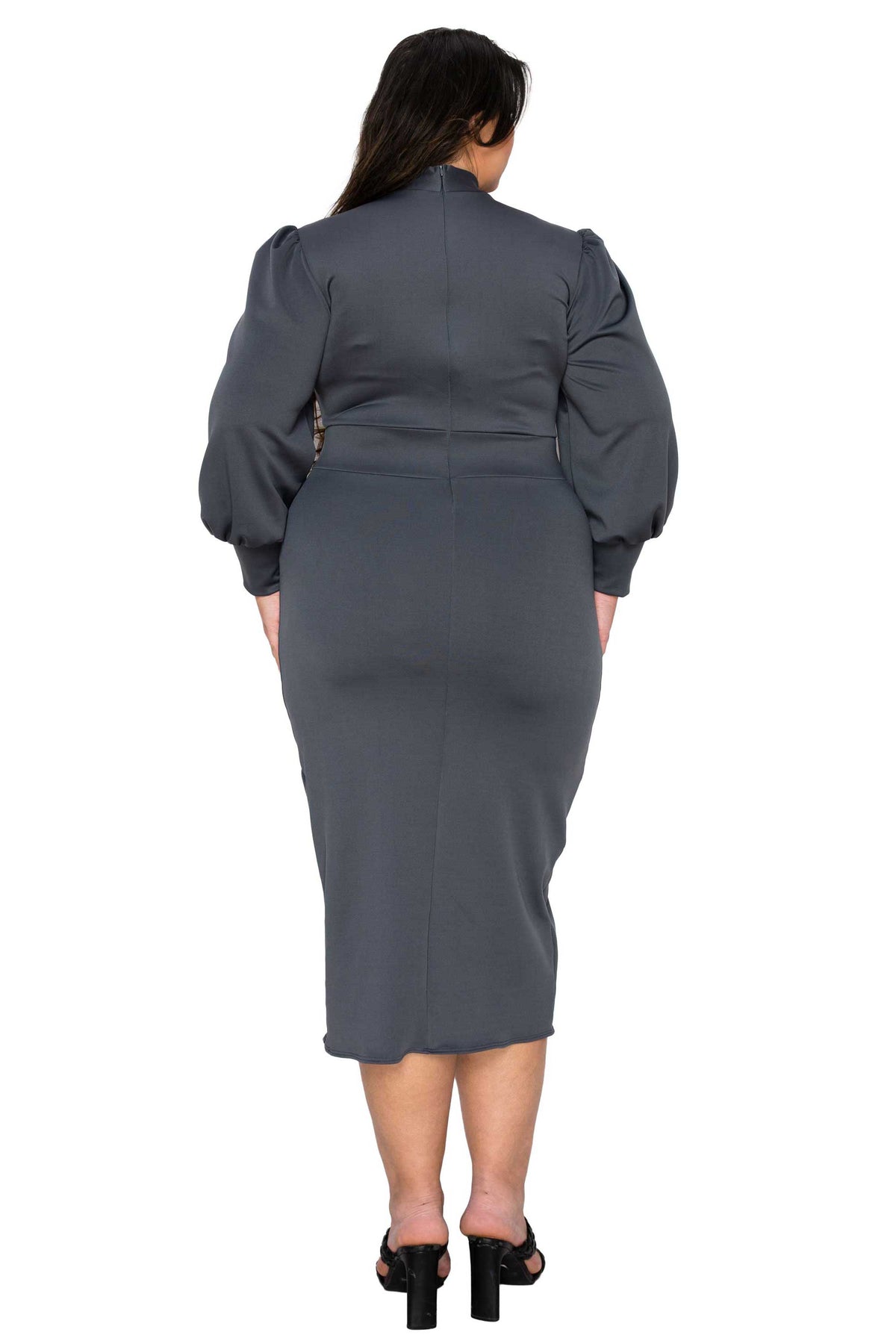 Woman wearing a gray dress with puff sleeves from behind on a white background