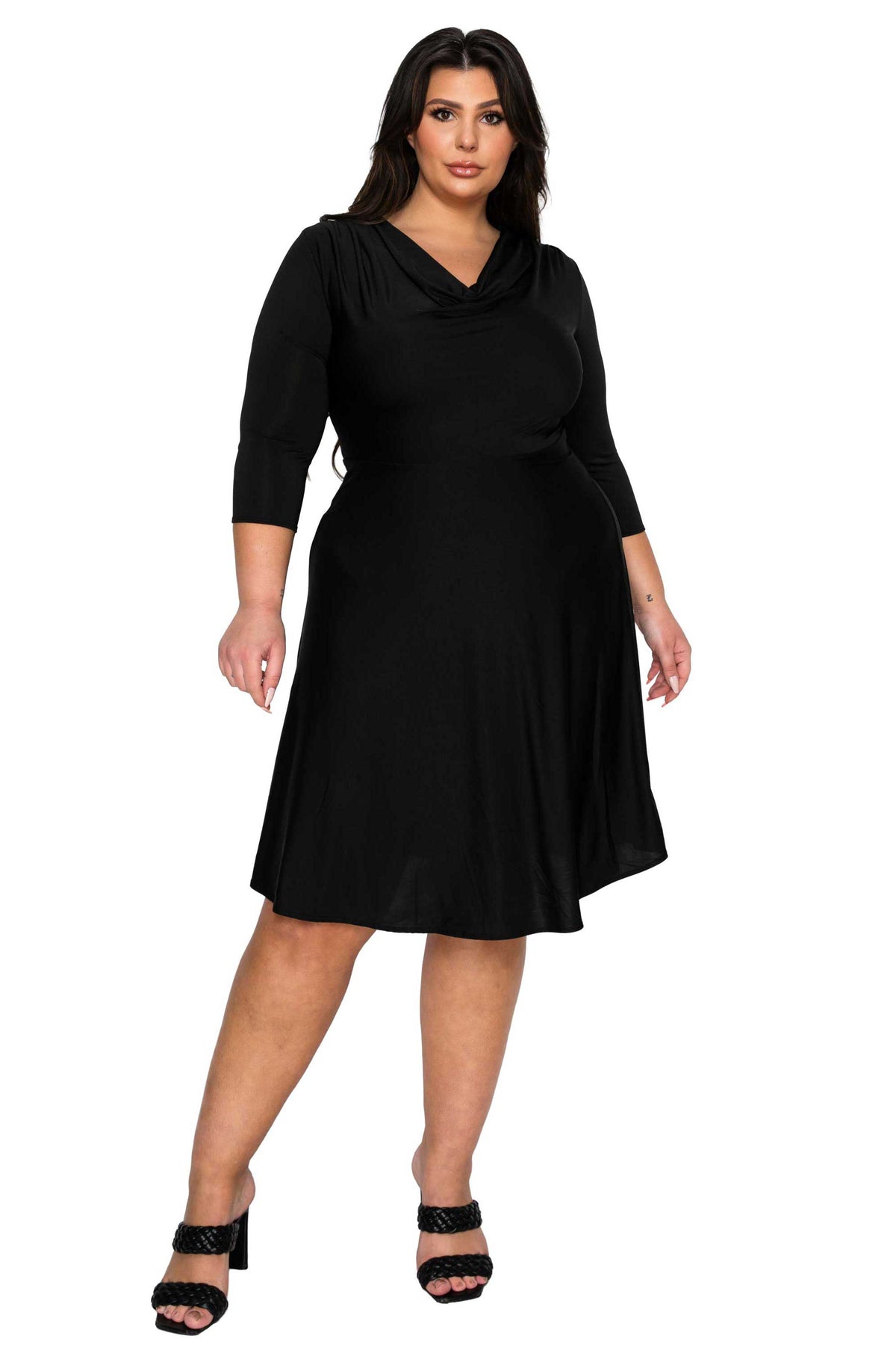 Woman wearing a black dress on a white background