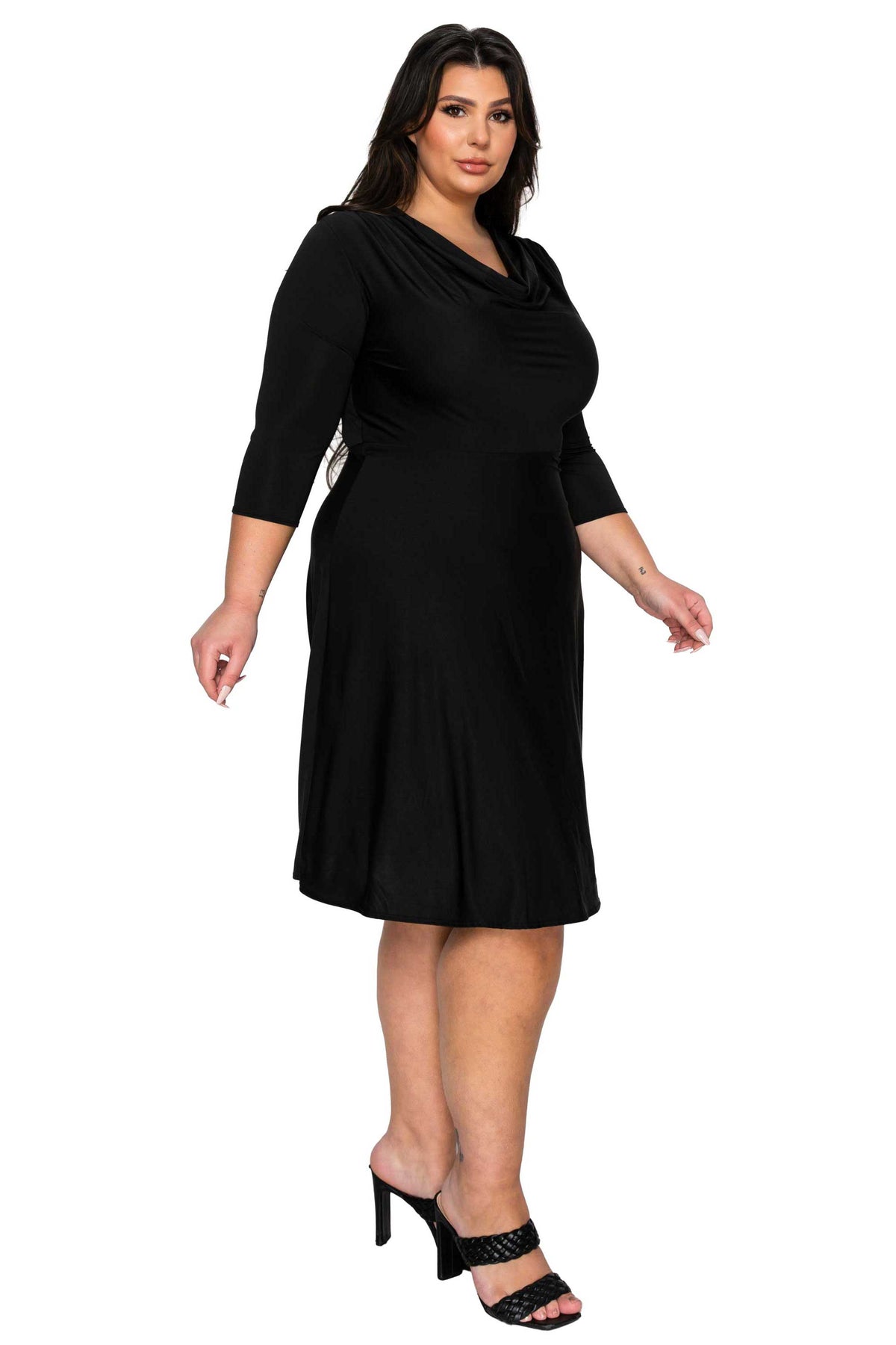 Woman wearing a black dress on a white background