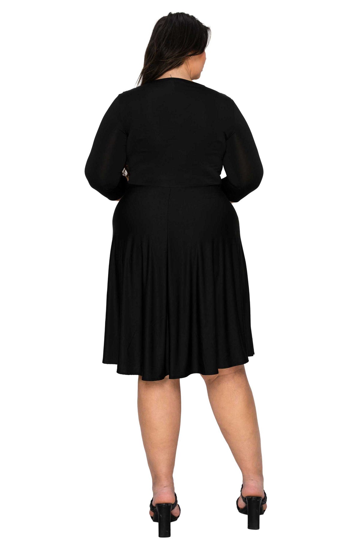 Person wearing a black dress from behind on a white background